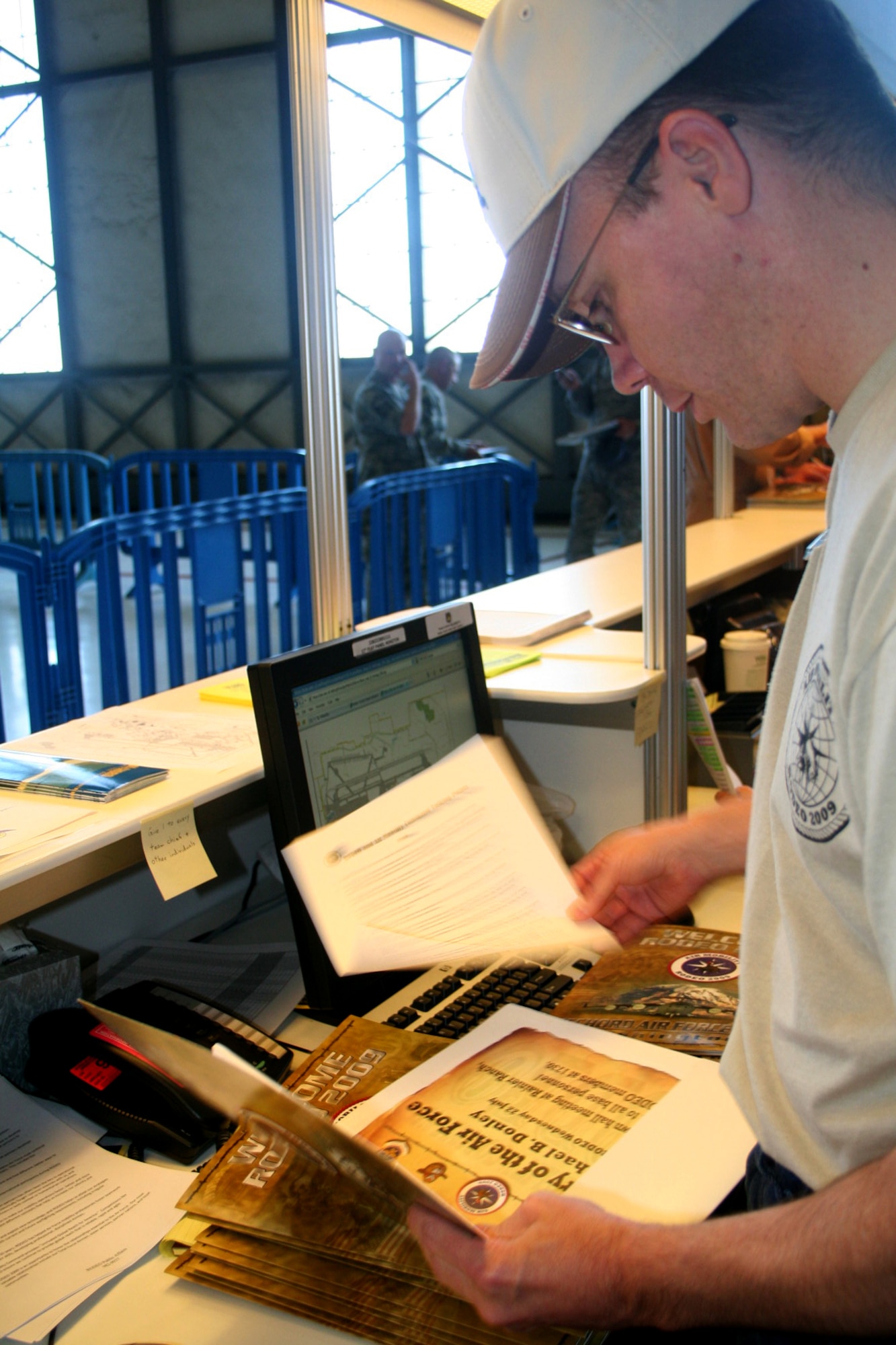 Staff Sgt. David Aebi, 446th Air Maintenance Squadron C-17 hydraulics specialist, prepares welcome books for incoming Air Mobility RODEO personnel July 18, 2009, at McChord Air Force Base, Wash. His job is to be a point of contact for all RODEO personnel.  (U.S. Air Force Photo/Airman 1st Class Amber Kelly-Herar)
