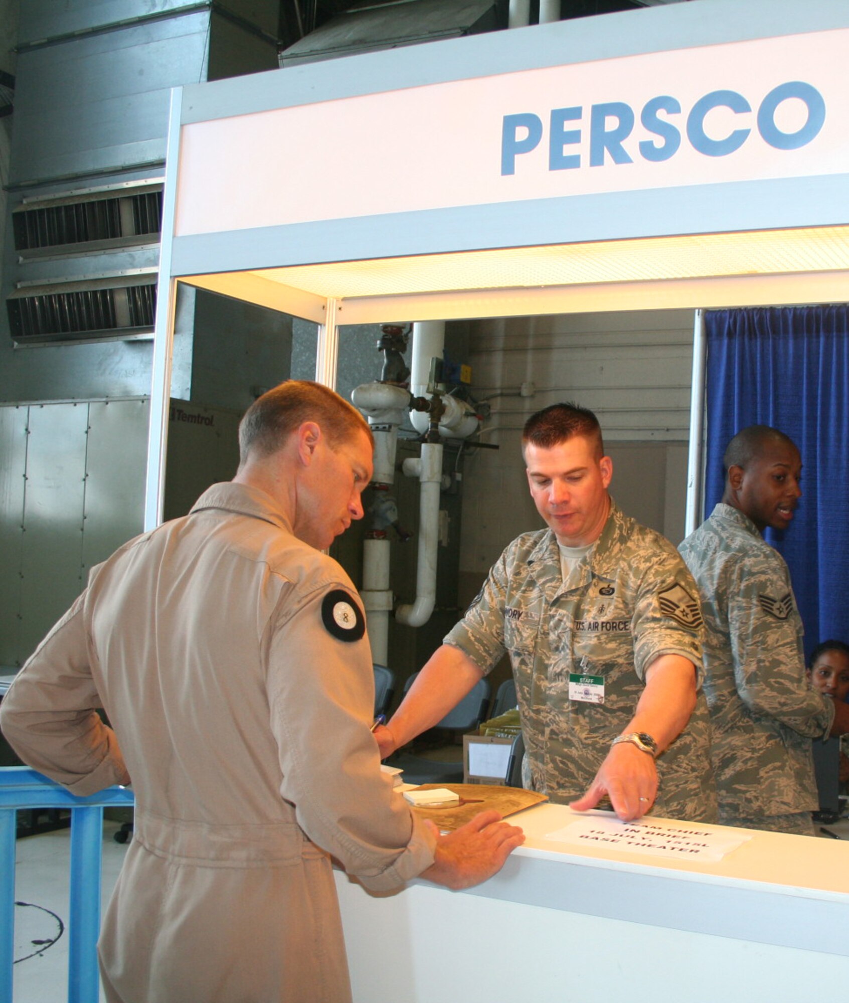 Master Sgt. Dave Swory, 62nd Force Support Squadron personnelist, greets Air Mobility RODEO personnel as they enter the in-processing line at McChord Air Force Base, Wash. Sergeant Swory is responsible for obtaining 100 percent accountability of all RODEO personnel so that if something were to happen, anyone here could be contacted immediately.  (U.S. Air Force Photo/Airman 1st Class Amber Kelly-Herar)
