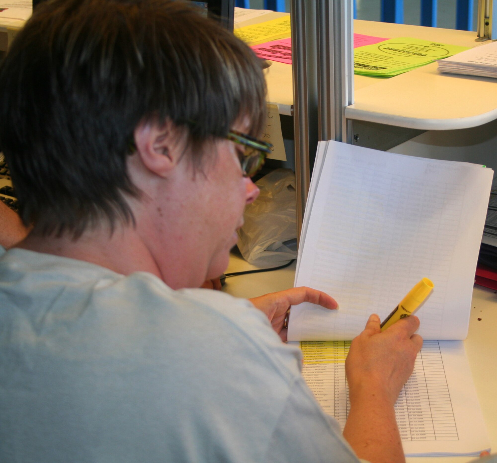 Kelly Wetzel, 62nd Force Support Squadron marketing director, highlights which Air Mobility RODEO personnel have paid their $20 landing fees July 18, 2009, at McChord Air Force Base, Wash. Landing fees are collected to help offset the events held at Ranier Ranch, including bands and meals.   (U.S. Air Force Photo/Airman 1st Class Amber Kelly-Herar)
