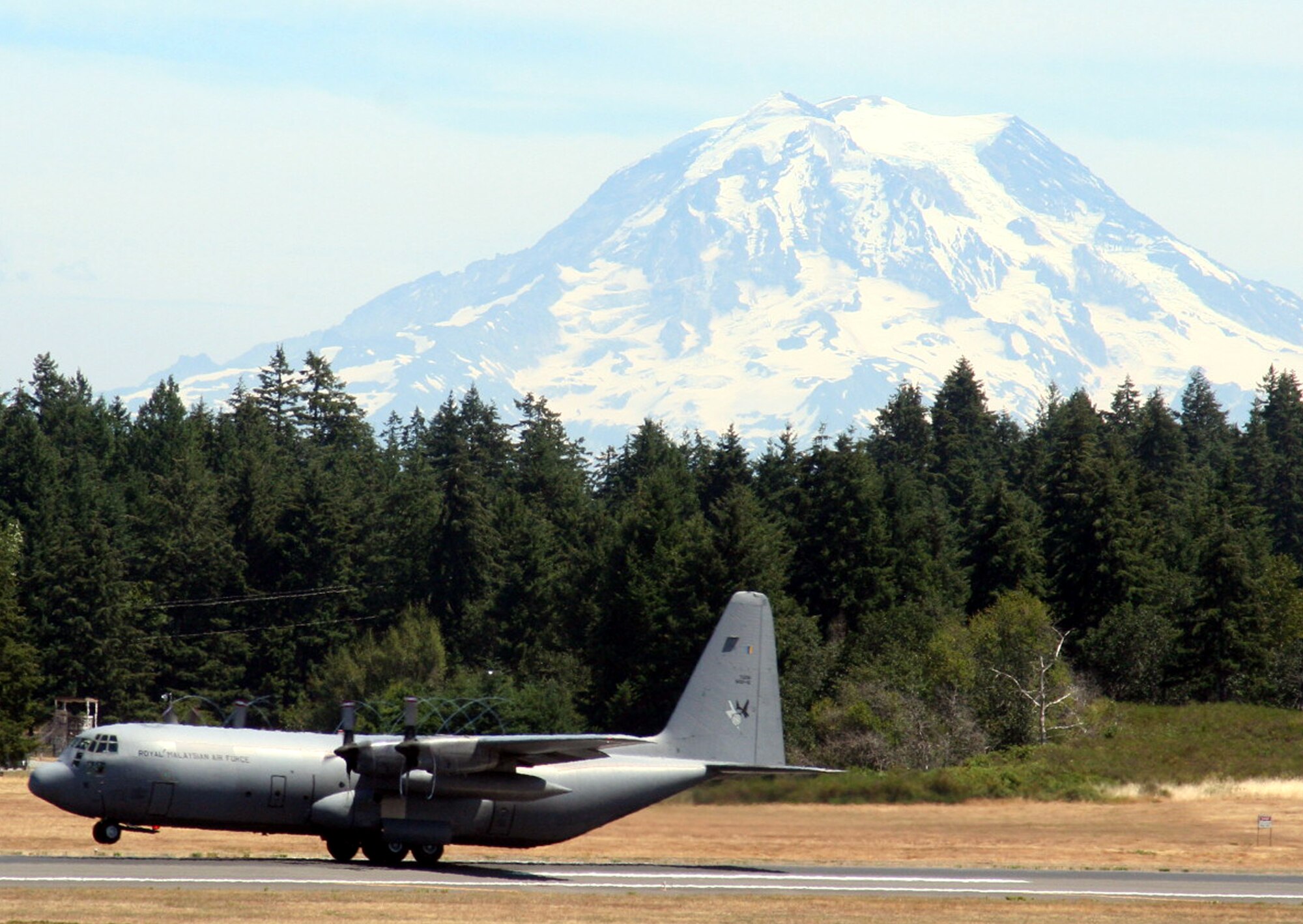 A Malaysian air force plane participating in Air Mobility Command's Rodeo 2009 takes off from McChord Air Force Base, Wash., for a flight July 18, 2009.  Malaysia is one of several foreign competitors in RODEO 2009. RODEO is the mobility air force's readiness competition. It focuses on improving worldwide air mobility wartime and humanitarian core abilities.  (U.S. Air Force Photo/Tech. Sgt. Scott T. Sturkol)