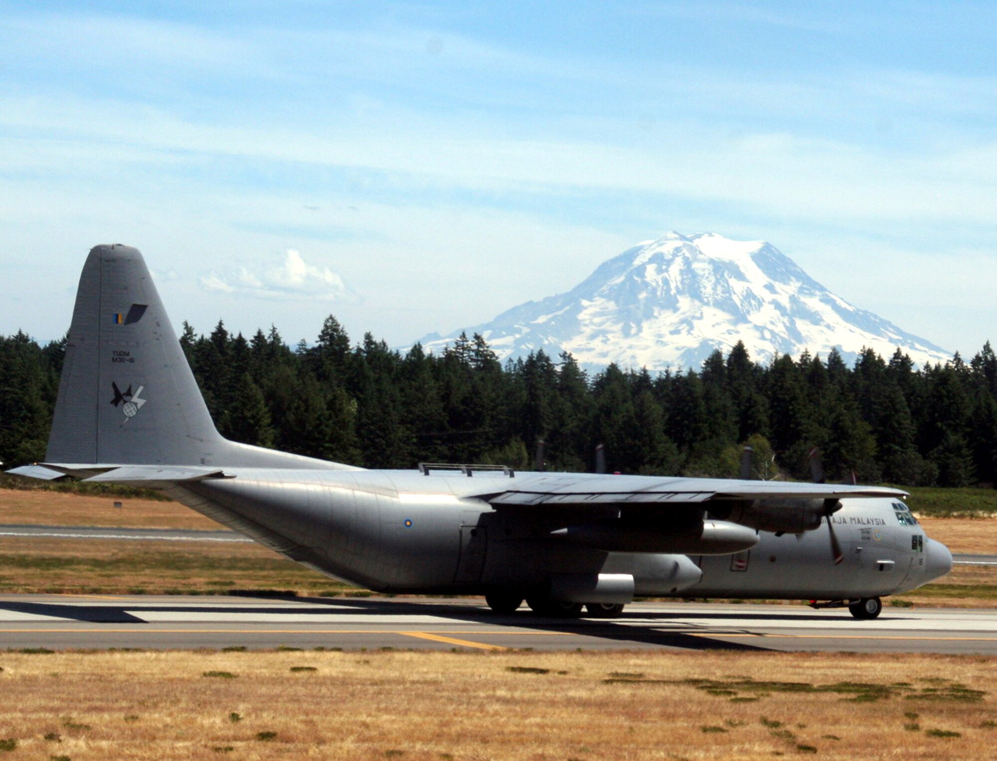 A Malaysian air force plane participating in Air Mobility Command's Rodeo 2009 takes off from McChord Air Force Base, Wash., for a flight July 18, 2009.  Malaysia is one of several foreign competitors in RODEO 2009. RODEO is the mobility air force's readiness competition. It focuses on improving worldwide air mobility wartime and humanitarian core abilities.  (U.S. Air Force Photo/Tech. Sgt. Scott T. Sturkol)