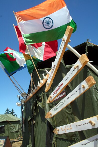 A tent is decorated with international flags in Rainier Ranch on McChord Air Force Base, Wash., July 18, 2009.  Rainier Ranch serves as "entertainment central" for Air Mobility Command's RODEO 2009.  The ranch is an open space holding 46 tents where some of the more than 100 teams participating in RODEO can display items from their unit, base or country.  (U.S. Air Force Photo/Tech. Sgt. Scott T. Sturkol)