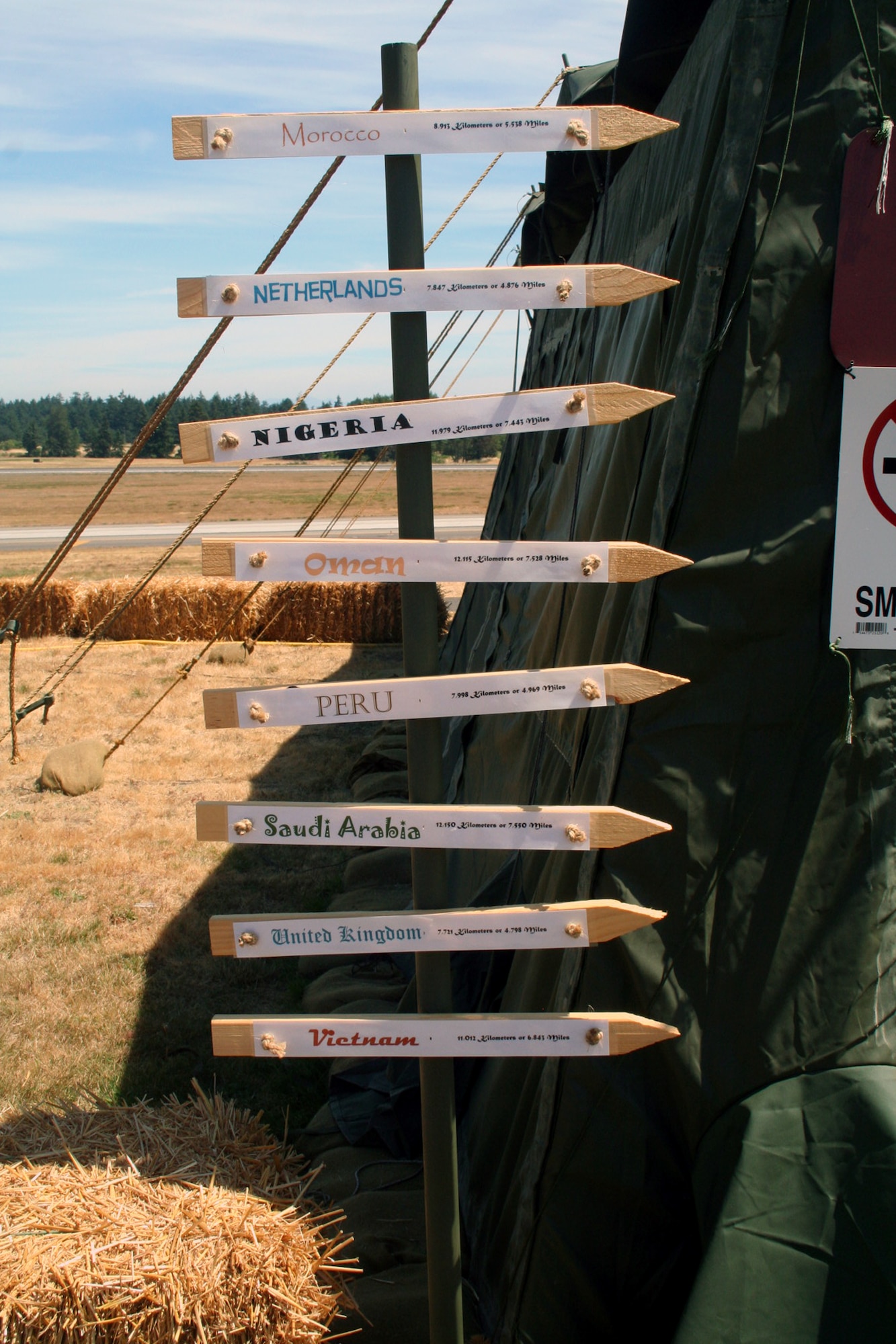 A sign highlighting the international flavor is displayed in Rainier Ranch on McChord Air Force Base, Wash., July 18, 2009.  Rainier Ranch serves as "entertainment central" for Air Mobility Command's RODEO 2009.  The ranch is an open space holding 46 tents where some of the more than 100 teams participating in RODEO can display items from their unit, base or country.  (U.S. Air Force Photo/Tech. Sgt. Scott T. Sturkol)