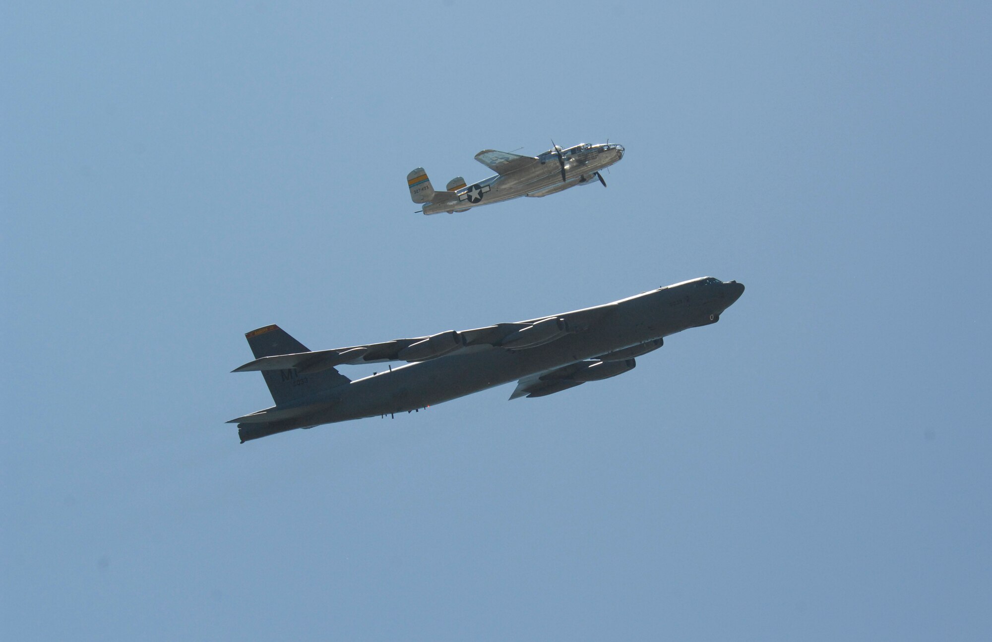MINOT AIR FORCE BASE, N.D. -- The B-25 Mitchell and B-52H Stratofortress perform a formation flyby as part of a heritage flight during the 2009 Northern Neighbors Day here July 18. Thousands of people turned out to watch the 2009 Northern Neighbors Day, which came through on its promise to wow spectators with amazing aerial maneuvers, nail-biting choreography, historic displays and much more. (U.S. Air Force Photo by Airman 1st Class Jesse Lopez)