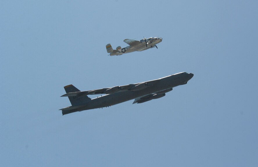 MINOT AIR FORCE BASE, N.D. -- The B-25 Mitchell and B-52H Stratofortress perform a formation flyby as part of a heritage flight during the 2009 Northern Neighbors Day here July 18. Thousands of people turned out to watch the 2009 Northern Neighbors Day, which came through on its promise to wow spectators with amazing aerial maneuvers, nail-biting choreography, historic displays and much more. (U.S. Air Force Photo by Airman 1st Class Jesse Lopez)