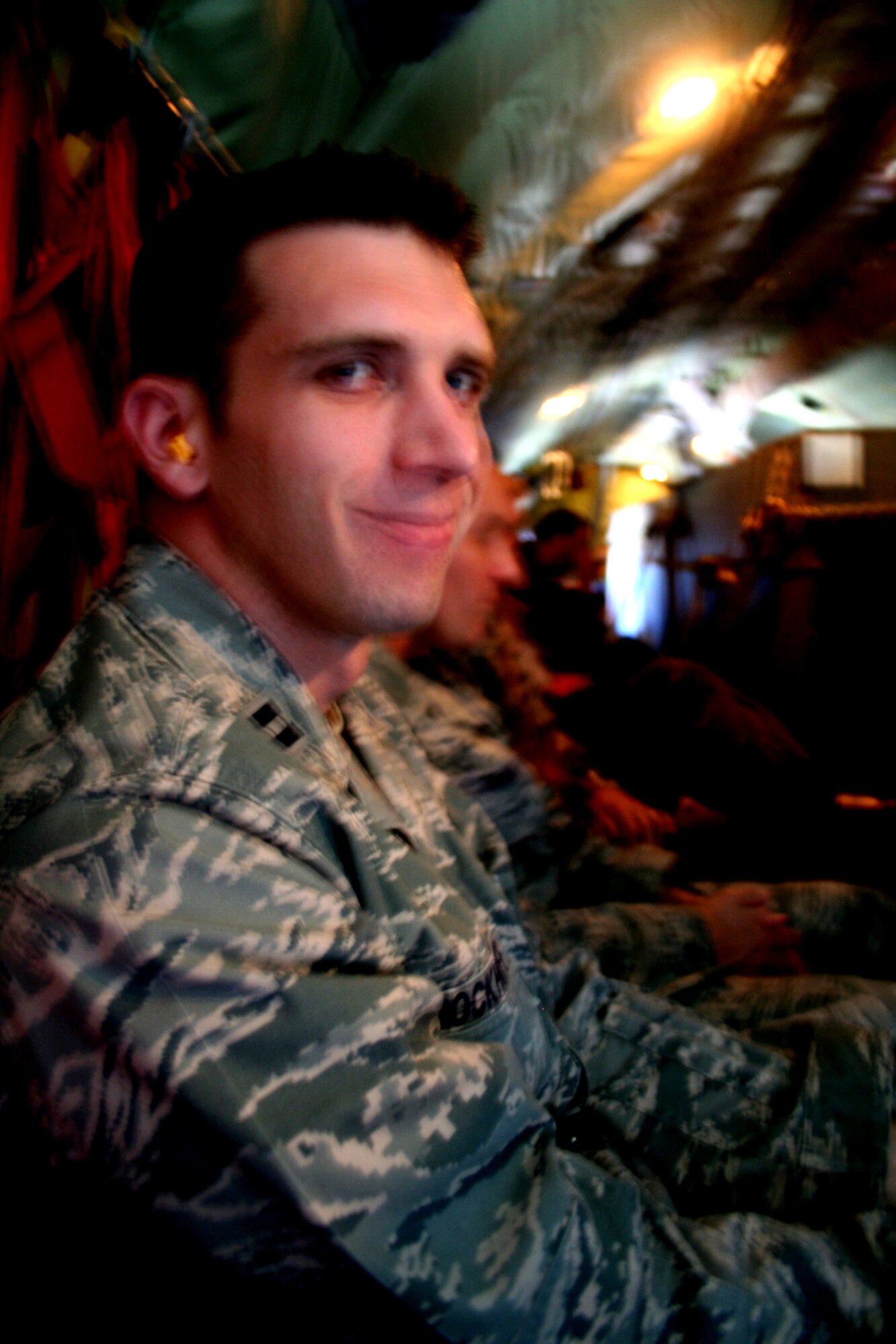 Capt. Justin Brockhoff, public affairs officer for the Tanker Airlift Control Center at Scott Air Force Base, Ill., flies on a KC-135R Stratanker en route from Scott to McChord AFB, Wash., for Air Mobility Command's RODEO 2009, July 17.  Captain Brockhoff was among dozens of Airmen and Department of Defense civilians from Scott going to RODEO to work as part of RODEO staff.  (U.S. Air Force Photo/Tech. Sgt. Scott T. Sturkol)