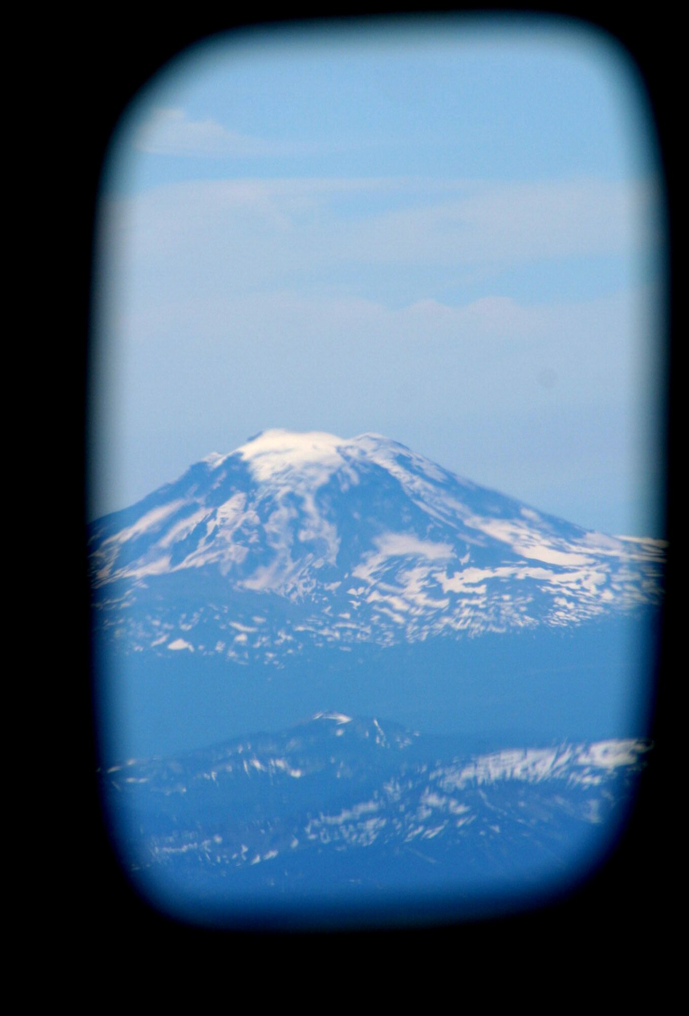 Mount Rainier in Washington state is seen from the window of a KC-135R Stratotanker from the Pennsylvania Air National Guard's 171st Air Refueling Wing at Pittsburgh, Penn., on approach to McChord Air Force Base, Wash.  The KC-135 was taking staff and participants for Air Mobility Command RODEO 2009 at McChord.  More than 100 teams and 2,500 people from the U.S. Air Force, Air Force Reserve, Air National Guard and selected foreign countries will compete in RODEO competition. It will include more than 50 competition events covering air mobility, flight and ground specialties and focuses on combat skills.  (U.S. Air Force Photo/Tech. Sgt. Scott T. Sturkol)