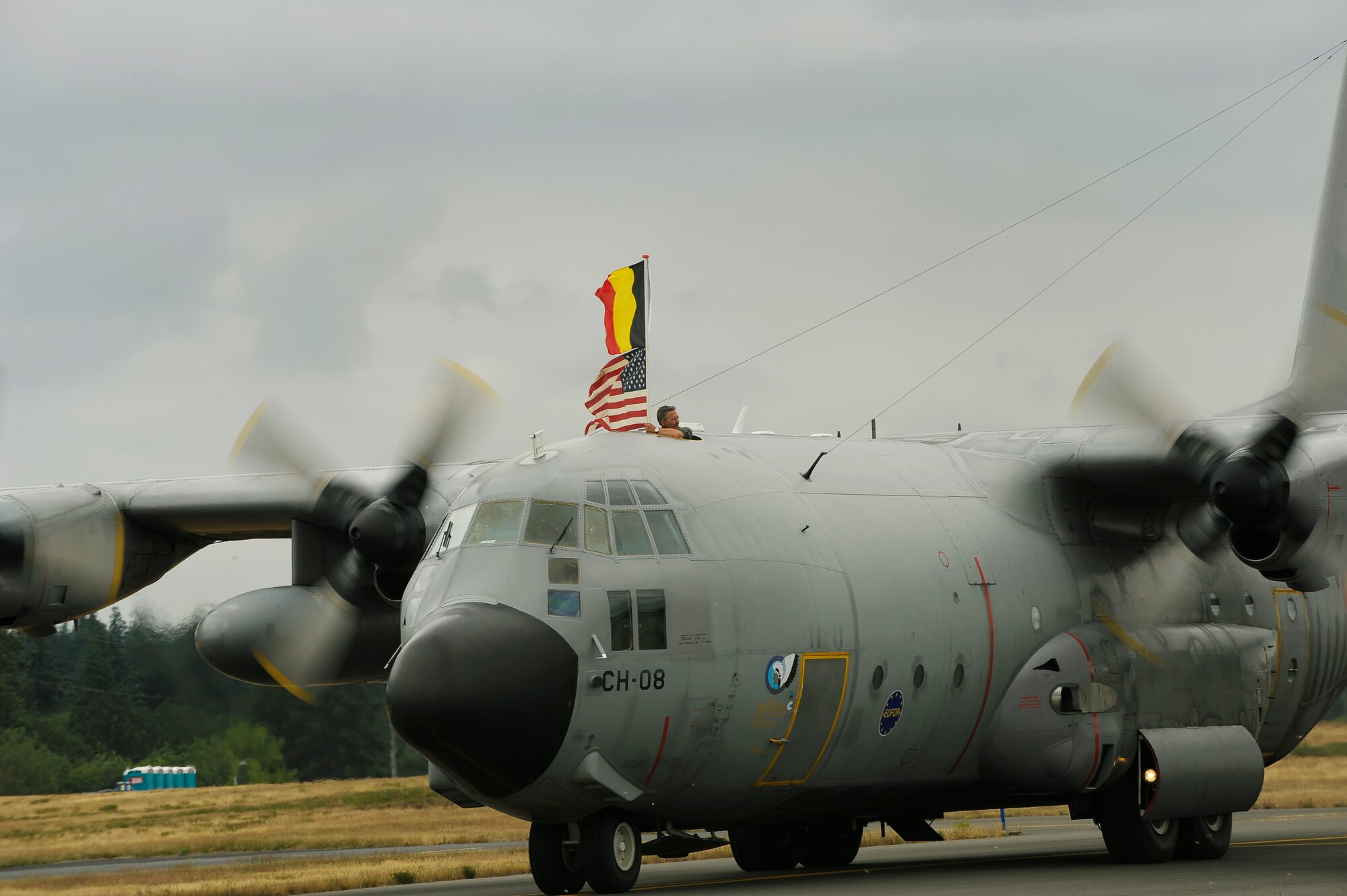 Flags are raised as the Belgium team arrives to McChord AFB, Washington; July 13th, in respect to the 2009 Air Mobility Rodeo.  Rodeo is an international combat skills and flying operations competition designed to develop and improve techniques and procedures with our international partners to enhance mobility operations. (U.S Air Force photo by SrA Dayton Mitchell/Released)