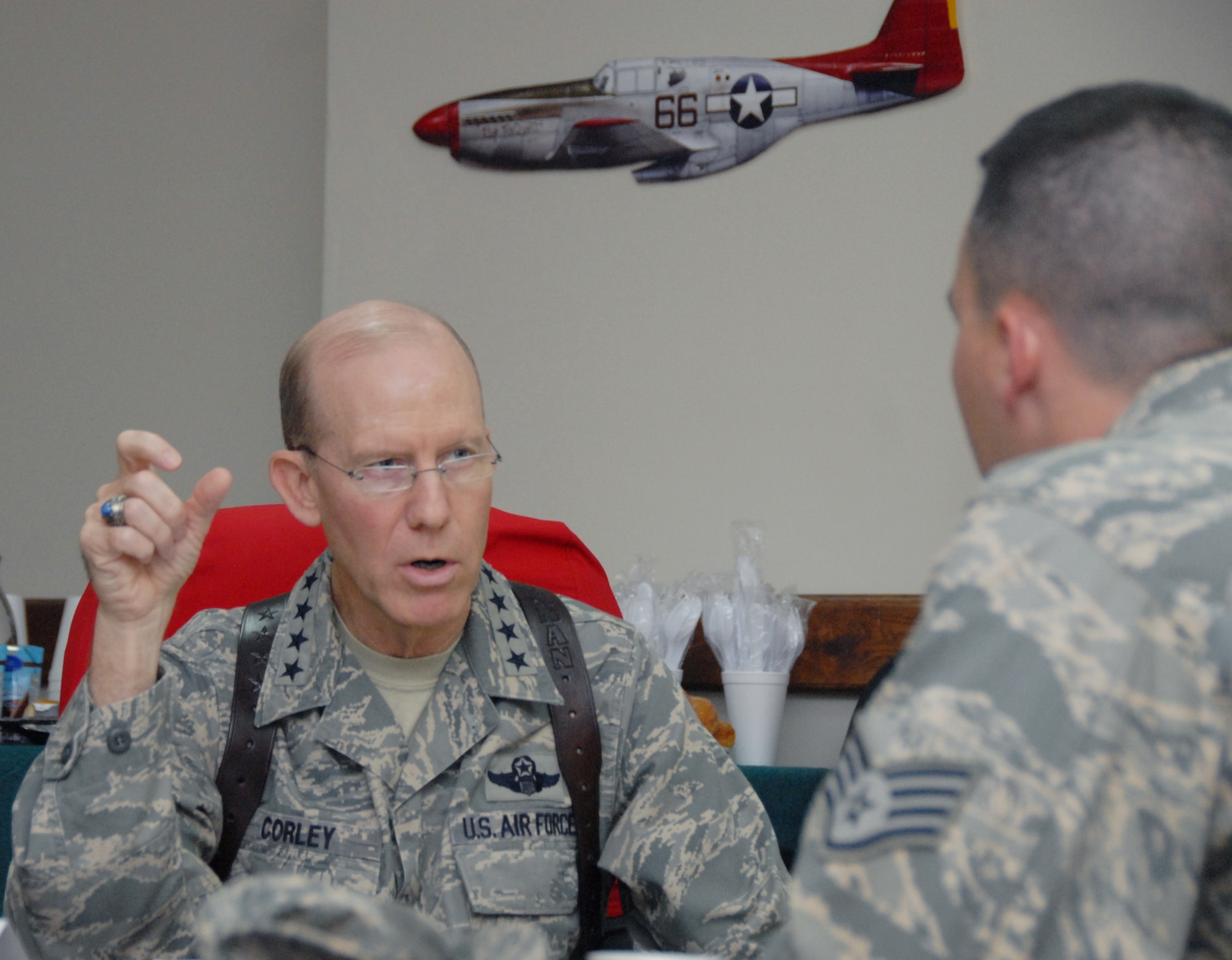 Gen. John D.W. Corley, commander of Air Combat Command, answers a question from Staff Sgt. Jake Richmond, 332nd Air Expeditionary Wing public affairs specialist during an interview at the wing headquarters building here July 17. General Corley surveyed various missions at JBB and spoke about them in the interview. (U.S. Air Force photo/Senior Airman Nicole Enos)
