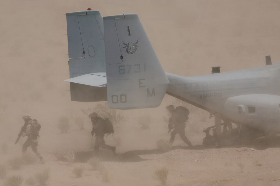 Marines with 3rd Battalion, 6th Marine Regiment, move to firing positions during a Clear Hold Build exercise with Marine Medium Tiltrotor Squadron 261 at Quackenbush Training Area aboard the Combat Center July 19.