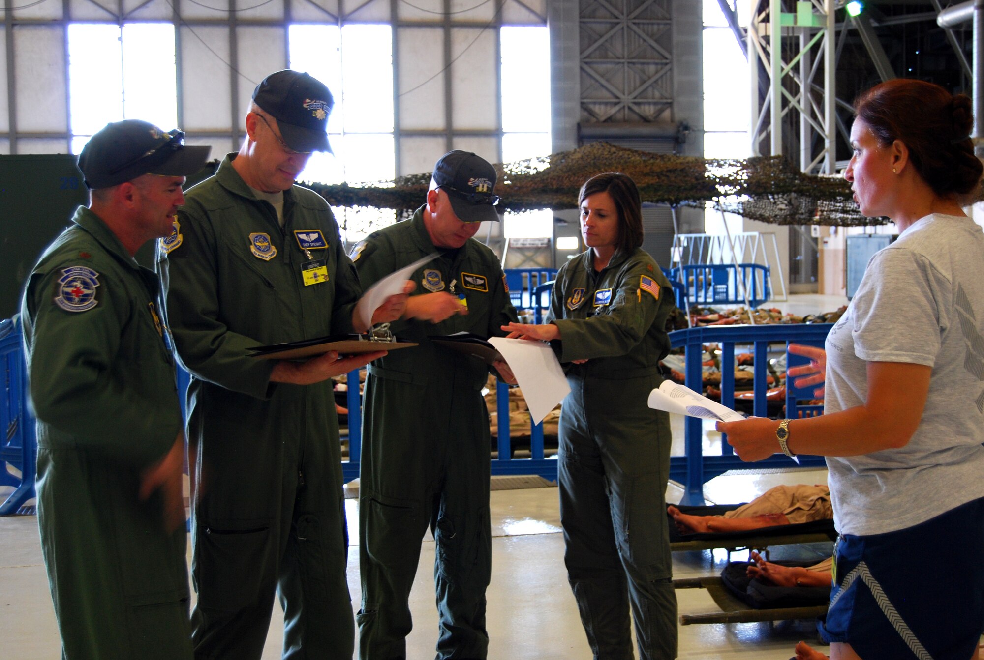 Flight nurse umpires are briefed on different scenarios by Lt. Col. Elizabeth Shaw, Air Mobility RODEO 2009 lead umpire at McChord Air Force Base, Wash., that could occur during the aeromedical evacuation competition July 19. (U.S. Air Force Photo/Airman 1st Class Amber Kelly-Herard)