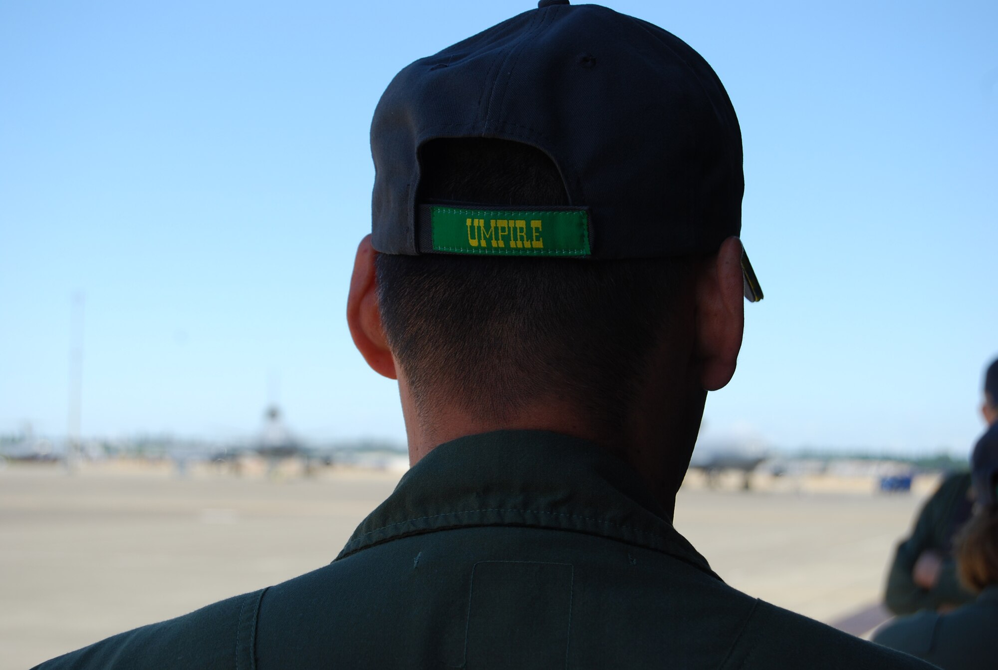 Maj. Jenaro “J.P.” Wirth, 62nd Aeromedical Evacuation Squadron flight examiner, dons the umpire hat as he is briefed on the Air Mobility RODEO 2009 aeromedical evacuation competition July 19, 2009, at McChord Air Force Base, Wash. (U.S. Air Force Photo/Airman 1st Class Amber Kelly-Herard)