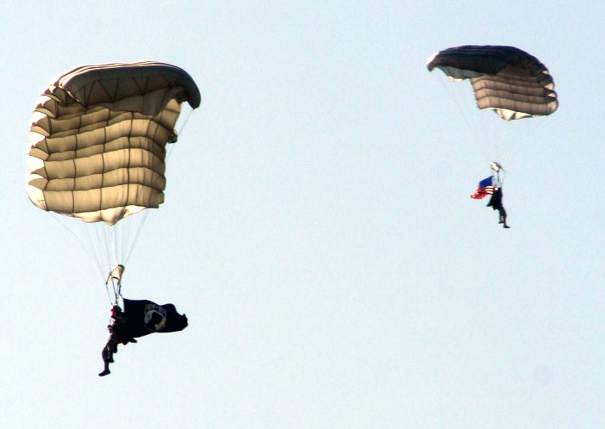 Airmen from the 22nd Special Tactics Squadron parachute in the POW/MIA flag and the American flag for the opening ceremonies for Air Mobility Command's RODEO 2009 July 19 at McChord Air Force Base, Wash.  More than 100 teams are participating in RODEO competition, including teams from seven foreign countries. RODEO is the U.S. Air Force's and AMC's premier air mobility competition. It's an international combat skills and flying operations competition designed to develop and improve techniques, procedures and interoperability with international partners to optimize mobility partnerships and enhance mobility operations. (U.S. Air Force Photo/Tech. Sgt. Scott T. Sturkol)