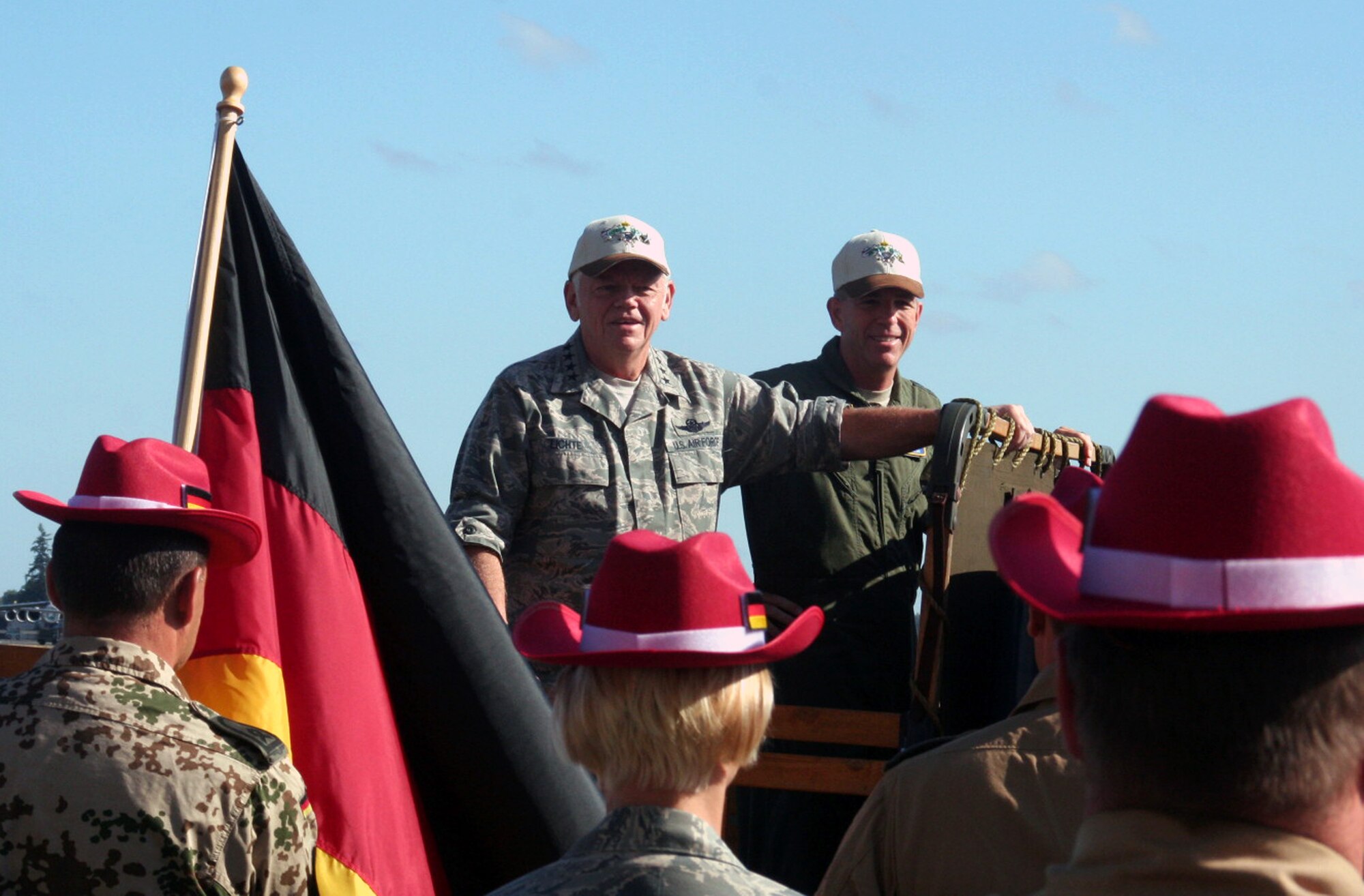 Gen. Arthur Lichte, Air Mobility Command commander, and Maj. Gen. Brooks Bash, RODEO 2009 commander, participate in the "pass and review" portion of the opening ceremonies for Air Mobility Command's RODEO 2009 July 19 at McChord Air Force Base, Wash.  More than 100 teams are participating in RODEO competition, including teams from seven foreign countries. RODEO is the U.S. Air Force's and AMC's premier air mobility competition. It's an international combat skills and flying operations competition designed to develop and improve techniques, procedures and interoperability with international partners to optimize mobility partnerships and enhance mobility operations. (U.S. Air Force Photo/Tech. Sgt. Scott T. Sturkol)