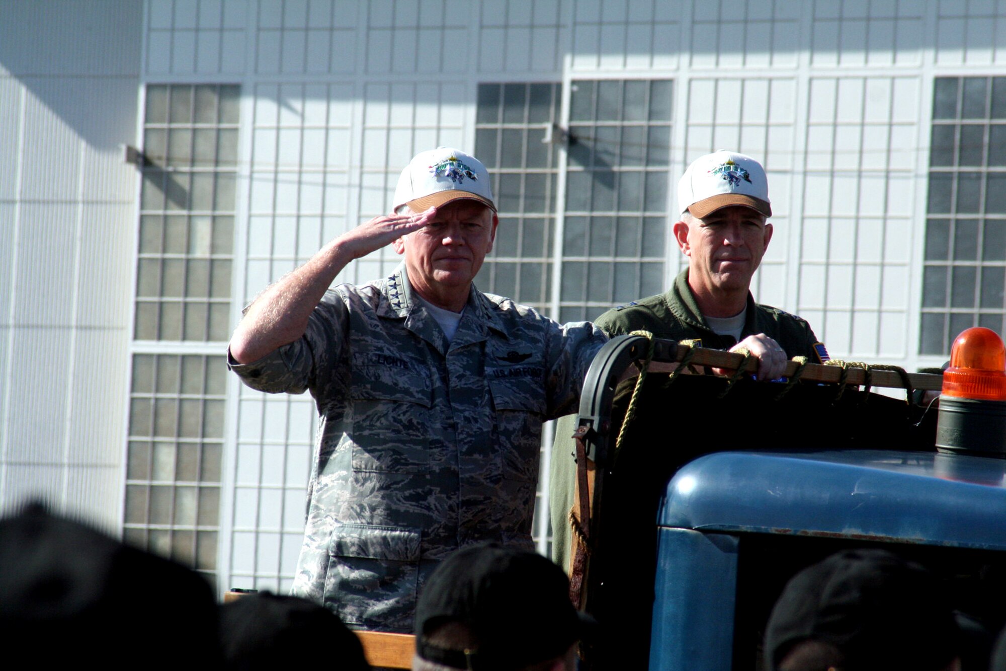 Gen. Arthur Lichte, Air Mobility Command commander, and Maj. Gen. Brooks Bash, RODEO 2009 commander, participate in the "pass and review" portion of the opening ceremonies for Air Mobility Command's RODEO 2009 July 19 at McChord Air Force Base, Wash.  More than 100 teams are participating in RODEO competition, including teams from seven foreign countries. RODEO is the U.S. Air Force's and AMC's premier air mobility competition. It's an international combat skills and flying operations competition designed to develop and improve techniques, procedures and interoperability with international partners to optimize mobility partnerships and enhance mobility operations. (U.S. Air Force Photo/Tech. Sgt. Scott T. Sturkol)