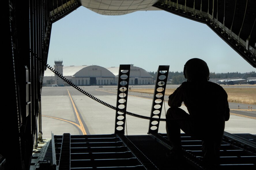 A German Air Force loadmaster looks out of the back of a C-160 while practicing for Air Mobility RODEO 2009 at McChord Air Force Base, Wash., July 19. RODEO is an international combat skills and combat operations competition designed to develop and improve techniques and procedures with our international partners to enhance mobility operations. (U.S. Air Force photo/Senior Airman Matthew Cook)