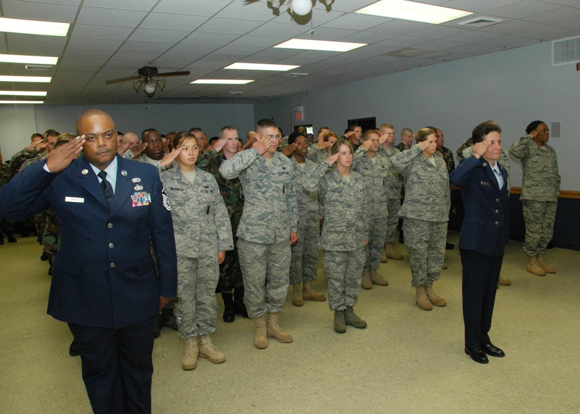 Members of the 131st Bomb Wing Mission Support Group render a first salute to their new commander, Colonel Terri Chaney, as she assumed command from Colonel Keith Smith during a ceremony on July 18 at the Base Community Center.  (Photo by Master Sgt. Mary-Dale Amison)