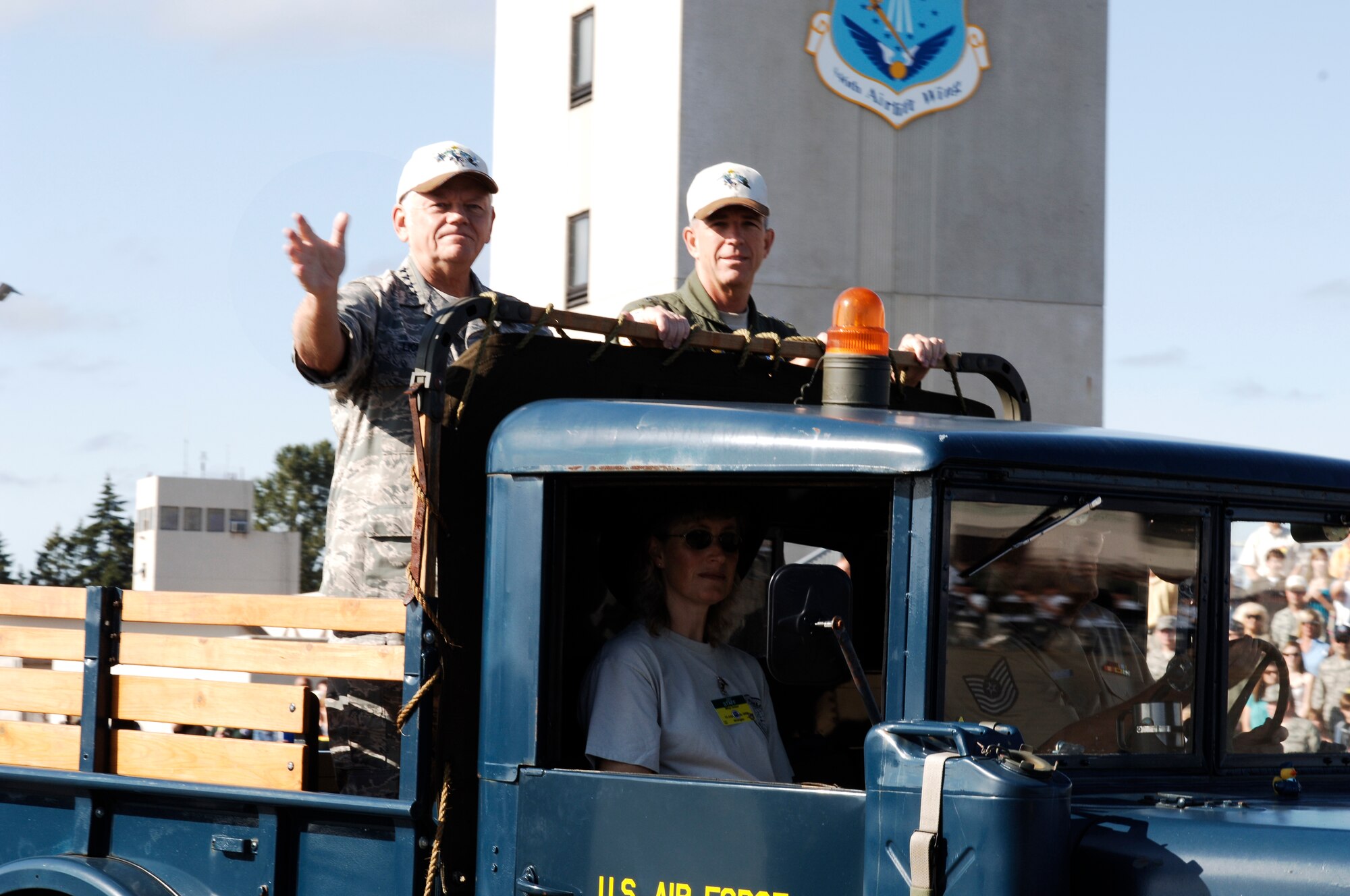 MCCHORD AIR FORCE BASE, Wash. -- Gen. Arthur J. Lichte, Air Mobility Command commander, and Maj. Gen. Brooks Bash, RODEO 2009 commander, wave to the crowd during the opening ceremony of RODEO 2009. RODEO is an international combat skills and flying operations competition designed to develop and omprove techniques and procedures with our international partners to enhance mobility operations. (U.S. Air Force photo/Senior Airman Emerald Ralston)