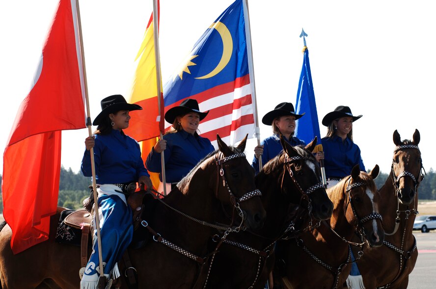 MCCHORD AIR FORCE BASE, Wash. -- A RODEO Starlet carries the American flag during the RODEO 2009 opening ceremony. RODEO is an international combat skills and flying operations competition designed to develop and improve techniques and procedures with our international partners to enhance mobility operations, optimizing mobility partnerships. (U.S. Air Force photo/Senior Airman Emerald Ralston)