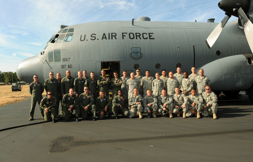 Members from the 317th Airlift Wing, Dyess Air Force Base, Texas, gather for a photo at McChord Air Force Base, Wash., as part of Air Mobility RODEO 2009, July 18. RODEO is an international combat skills and flying operations competition designed to develop and improve techniques and procedures with our international partners to enhance mobility operations. (U.S. Air Force photo by Tech. Sgt. Michelle Larche)