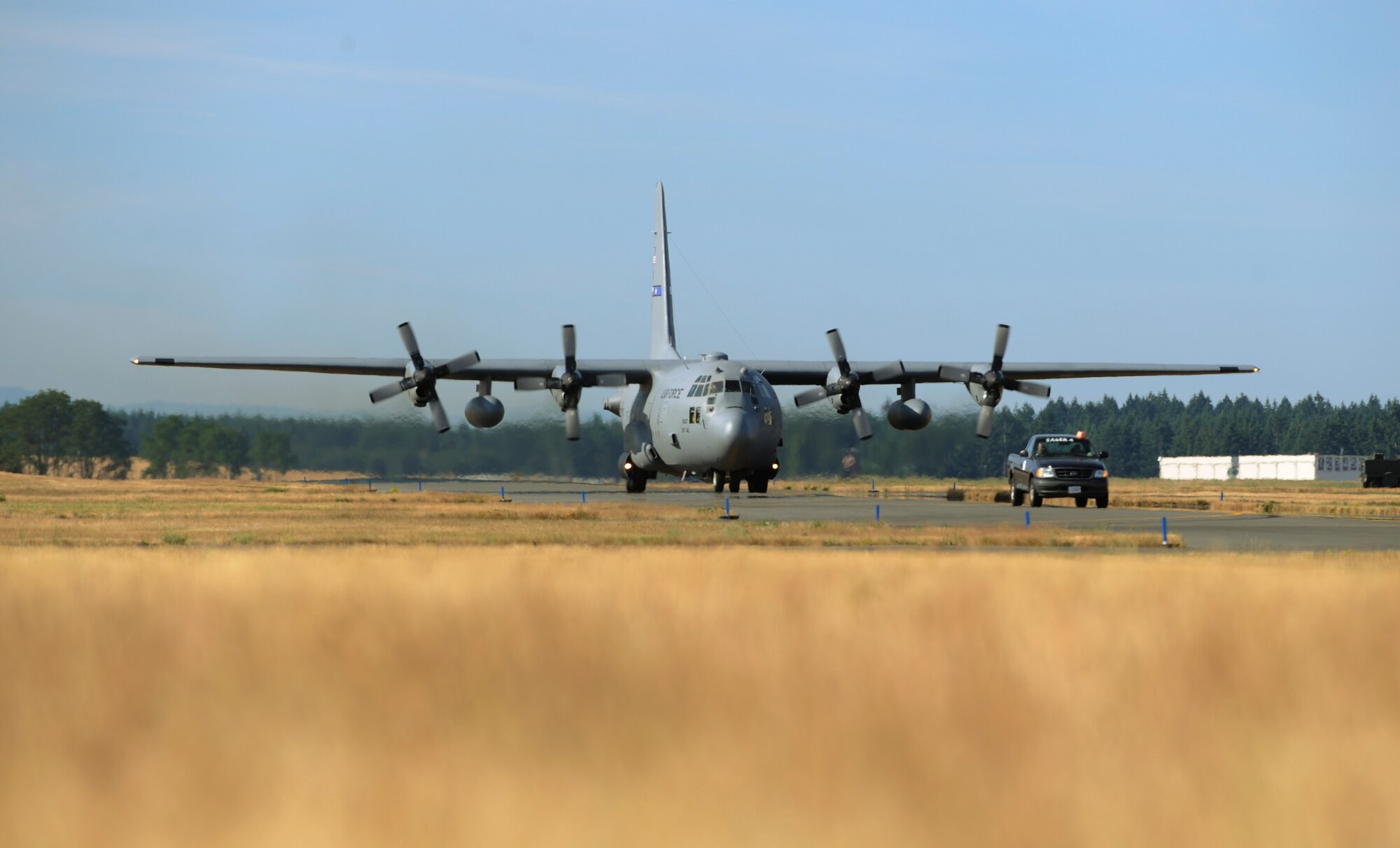 A C-130 Hercules from the 153rd Airlift Wing, Cheyenne, Wyo., taxis down the flightline at McChord Air Force Base, Wash., after arrival for Air Mobility RODEO 2009, July 18. RODEO is an international combat skills and flying operations competition designed to develop and improve techniques and procedures with our international partners to enhance mobility operations. (U.S. Air Force photo by Tech. Sgt. Michelle Larche)