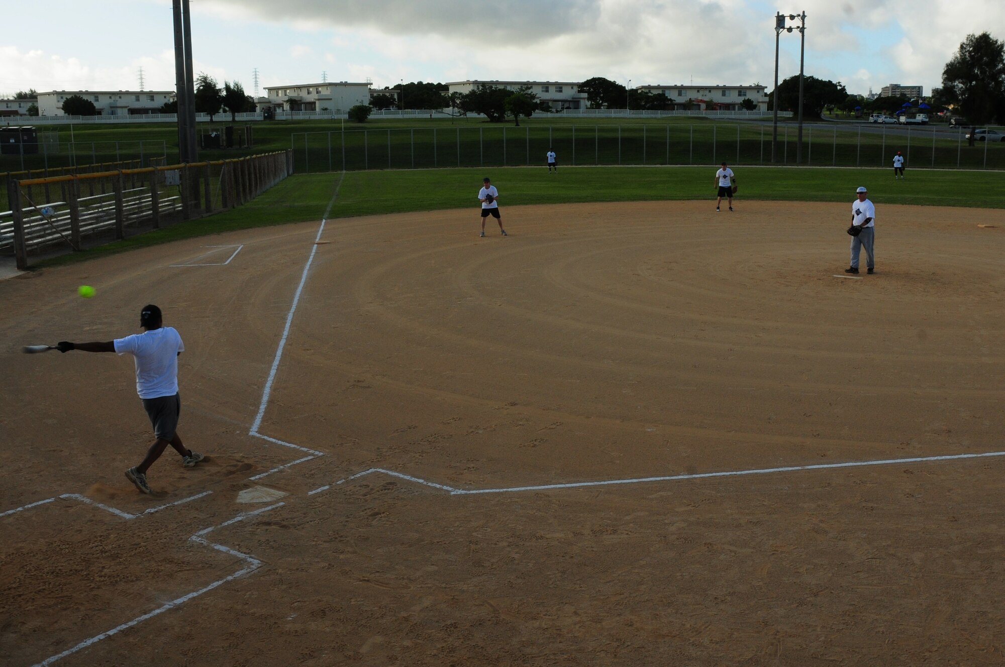 An Airman takes a swing at a pitch at the Dorm Softball Tournment at Kadena Air Base July 18. The First Sergeants Assocation, which sponsored the event, plans to hold the tournament annually.