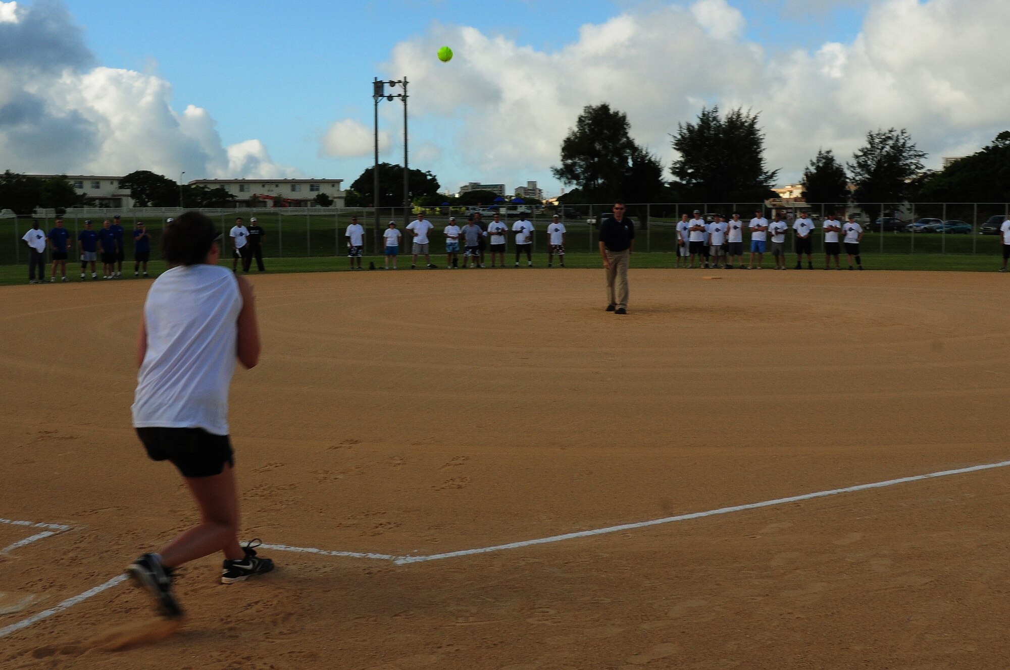 Colonel Kenneth Wilsbach, 18th Wing commander, throws out the first pitch at the Dorm Softball Tournment at Kadena Air Base July 18. The First Sergeants Assocation, which sponsored the event, plans to hold the tournament annually.
