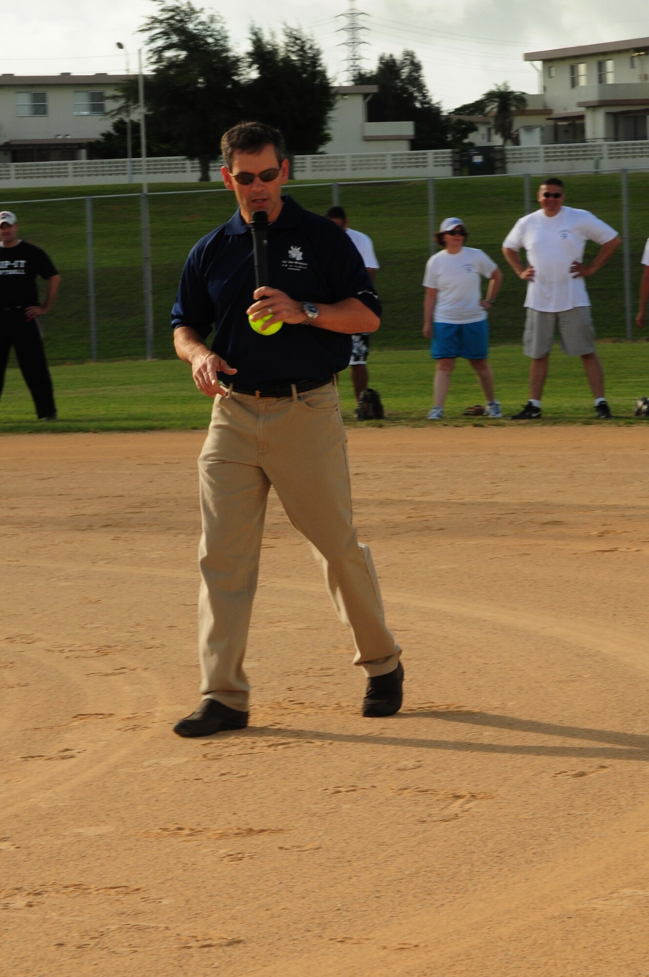 Colonel Kenneth Wilsbach, 18th Wing commander, speaks to softball players at the Dorm Softball Tournament at Kadena Air Base July 18. The First Sergeants Assocation, which sponsored the event, plans to hold the tournament annually. The purpose of the tournament was to involve dorm residents a little fellowship and friendly competition. Dorm 700 took the title.