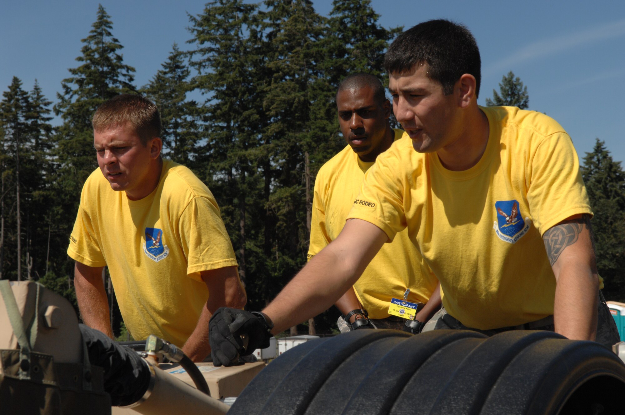 Airmen from 615th Contingency Response Wing of Travis Air Force Base, Calif., assemble the Hard-sided Expandable Light Air Mobile Shelter, or HELAMS, during Air Mobility RODEO 2009 competition July 20, 2009, at McChord Air Force Base, Wash.  Use of the shelter is a first for RODEO competition.  (U.S. Air Force Photo/Senior Airman Eric Ysasi)