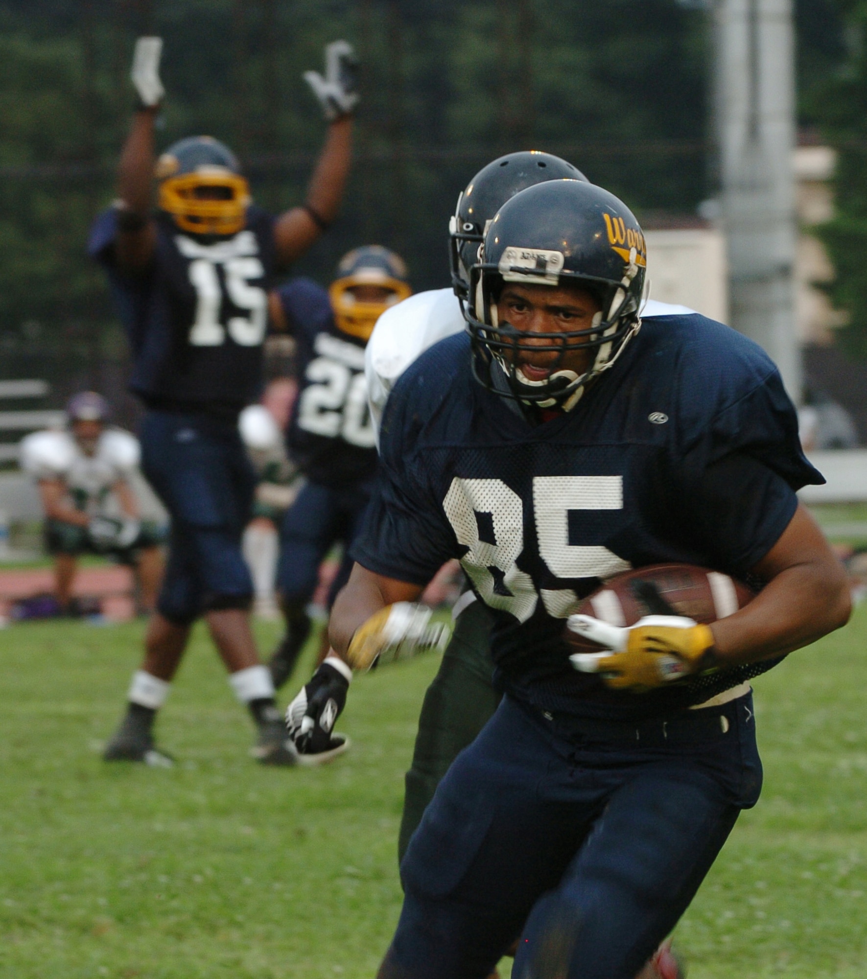 YOKOTA AIR BASE, Japan -- Yokota Warriors' linebacker Quinn Floyd returns a fumble for a touchdown during the second quarter of Yokota's 44-12 defeat of the Jets July 18 in the first round of the U.S. Forces Japan-American Football League playoffs at Bonk Field. The Warriors scored three defensive touchdowns in the first half to put the game out of reach early. Yokota travels to Yokosuka Aug. 1 to take on the Seahawks at 7 p.m. (U.S. Air Force photo/Master Sgt. Matt Summers)
