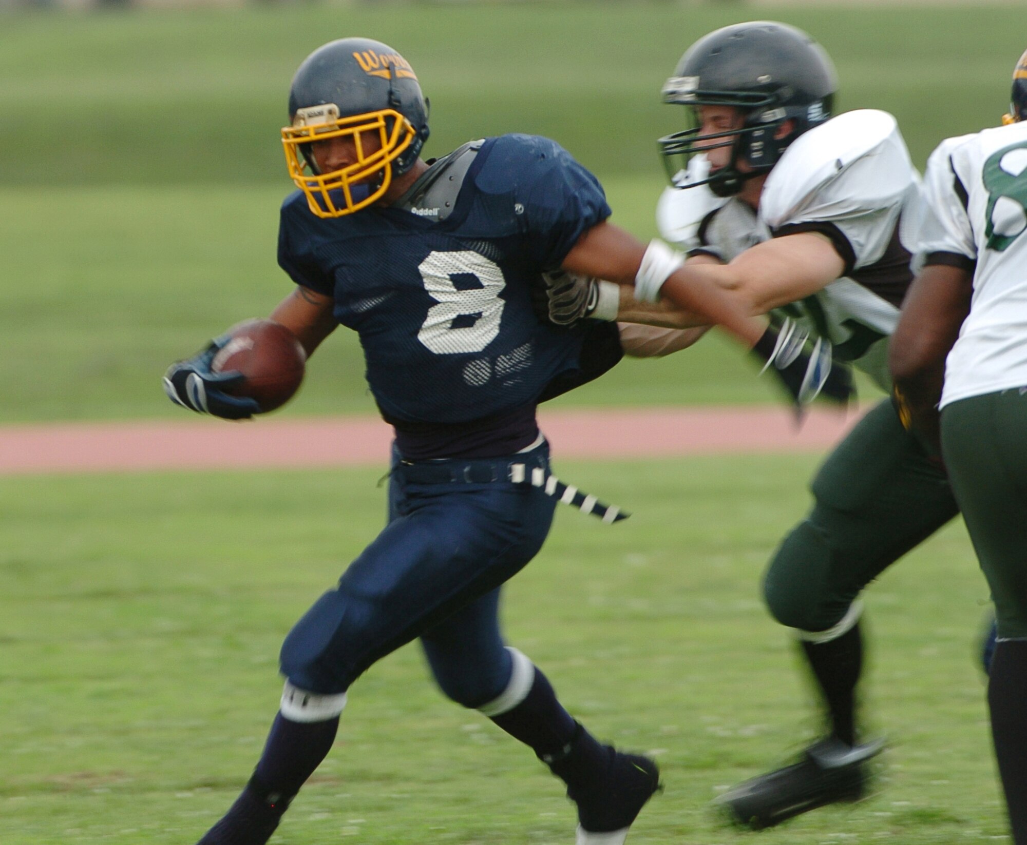 YOKOTA AIR BASE, Japan -- Yokota Warriors' running back Mike Mathis gets caught from behind during the first quarter of Yokota's 44-12 defeat of the Misawa Jets July 18 in the first round of the U.S. Forces Japan-American Football League playoffs at Bonk Field. The Warriors scored three defensive touchdowns in the first half to put the game out of reach early. Yokota travels to Yokosuka Aug. 1 to take on the Seahawks at 7 p.m. (U.S. Air Force photo/Master Sgt. Matt Summers)
