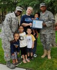 The Freeman family display their Home Your Proud of Award with Lt. Col. Jesse Johnson, and Lorie Dallas, July 14, 2009 Eielson Air Force Base, Alaska. Sergeant Freeman and his family are winners for area 3. Each winning houshold recieved gift cards from variouse units off base. Staff Sgt Ashley Freeman is with the Aircraft Maintenance Squadron, Colonel Johnson is the 354th Mission Support Group deputy commander, and Ms. Dallas, 354th CES military family housing chief of capital asset management. (U.S. Air Force photo/Airman 1st Class Laura Goodgame)