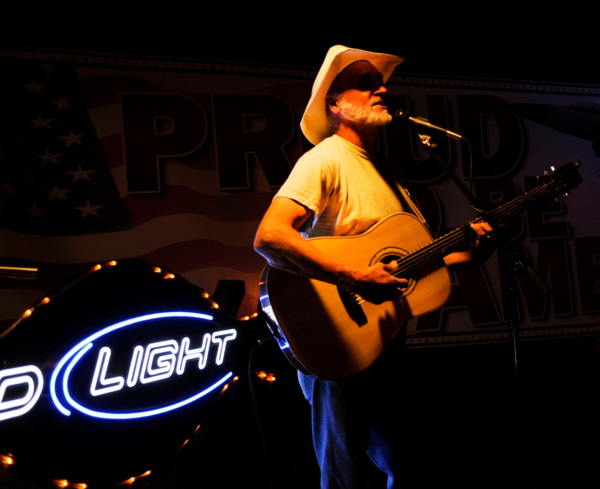 Comedian and folk singer Hobo Jim performs a free concert for Airmen and dependents at the Yukon Club July 14, 2009, Eielson Air Force Base, Alaska. Hobo Jim performed the free concert as a way to say thank you Airmen and their families for their service. (U.S. Air Force photo/Airman 1st Class Laura Goodgame)