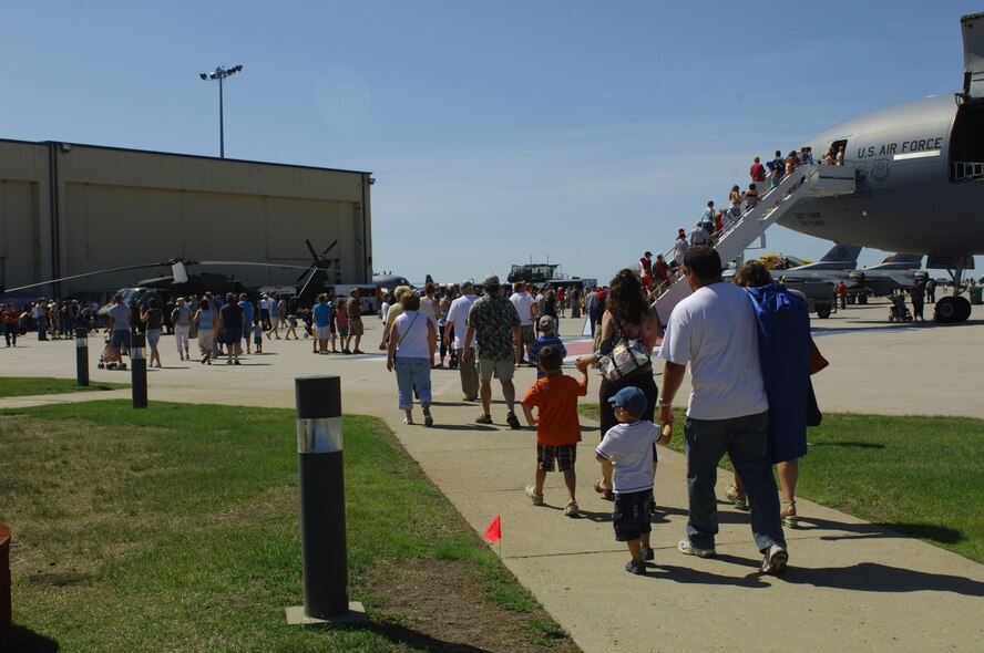 MINOT AIR FORCE BASE, N.D. -- Spectators from all around local community enter the flightline during the 2009 Northern Neighbors Day festivities here July 18. Thousands of people from the base and local community turned out to watch the 2009 Northern Neighbors Day, which came through on its promise to wow spectators with amazing aerial maneuvers, nail-biting choreography, historic displays and much more.   (U.S. Air Force photo by Tech. Sgt.  Lee A. Osberry Jr.)