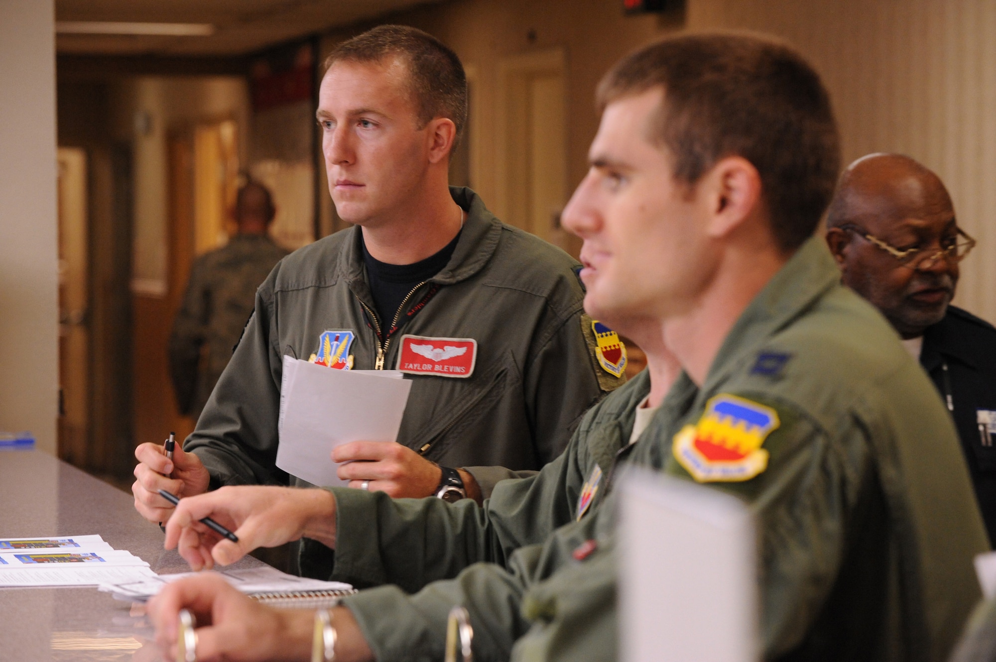 Capt. Taylor Blevins, 77th Fighter Squadron gets last minute updates from the operations desk before a training mission at Red Flag 09-4, Nellis Air Force Base, Nev.,  July 16, 2009. Red Flag is a highly-realistic combat training exercise that pits U.S. and allied nation air forces against 'enemy' forces in a challenging air, ground, cyberspace and electronic threat environment. (U.S. Air Force Photo/Tech. Sgt. Michael R. Holzworth)