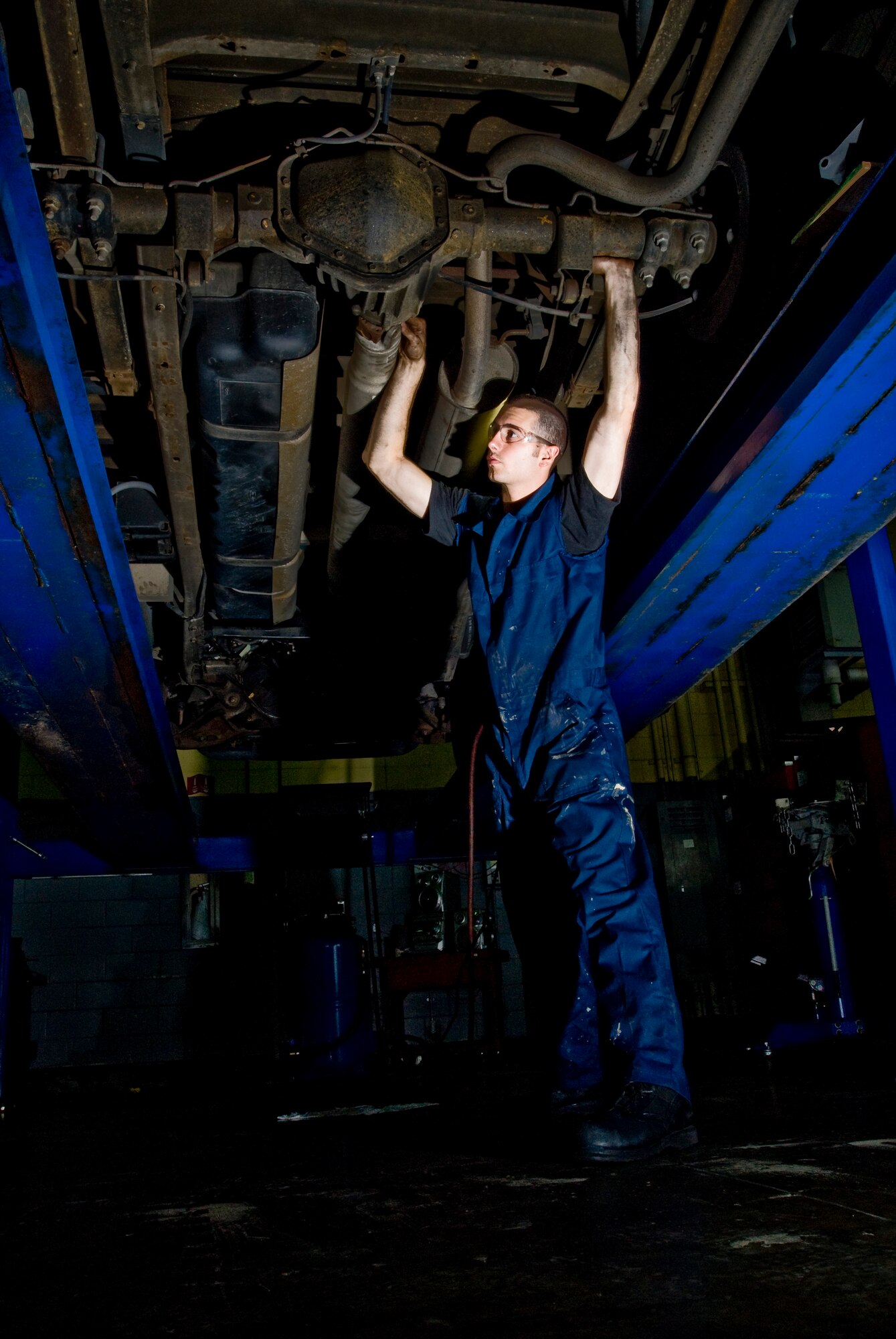 Airman First Class Christopher Smith installs the drive shaft after replacing the rear main sill on a transmission at Kunsan Air Base, Republic of Korea July 16. Airman Smith is a vehicle maintainer from the 8th Logistics Readiness Squadron, who is responsible for the upkeep of all vehicles on Kunsan Air Base. (U.S. Air Force Photo/Senior Airman Jonathan Steffen)