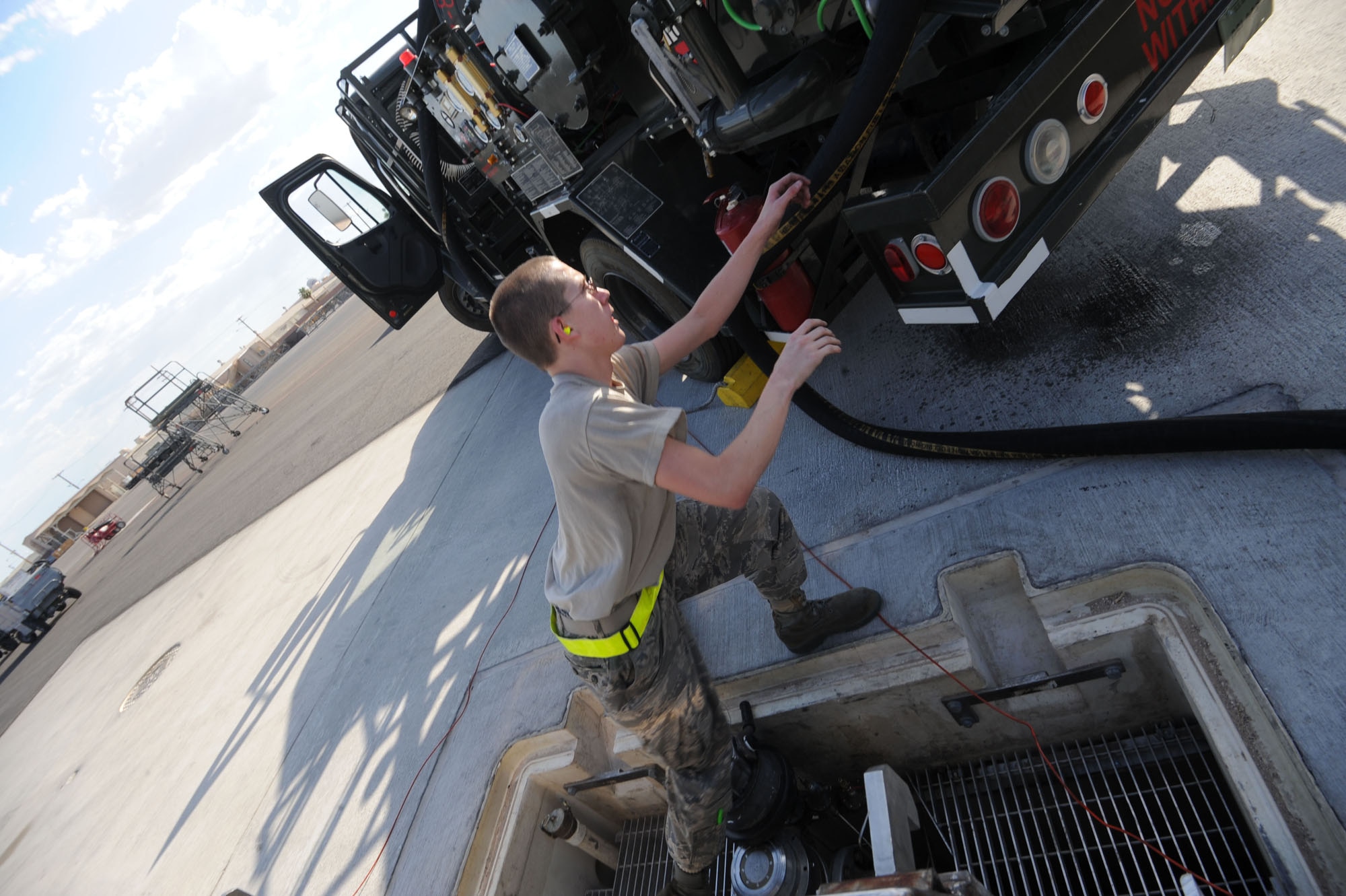 Airman 1st class Timothy Grusendorf , 99th logistics readiness squadron fuels specialist, off loads fuel July 17, 2009 during Red Flag 09-4.  Red Flag is a realistic combat training exercise involving the air forces of the United States and its allies. The exercise is conducted on the 15,000-square-mile Nevada Test and Training Range, north of Las Vegas. Red Flag is one of a series of advanced training programs administered by the U.S. Air Force Warfare Center and Nellis, through the 414th Combat Training Squadron. Flying for Red Flag 09-4 began July 13 and ends July 24. Units participating in 09-4 are from Nellis and Creech in Nevada, South Carolina, Idaho, the United Kingdom, Washington, Oklahoma and Ohio. Aircraft types include F-15s, F-16s, E-3s and KC-135s. In addition to U.S. aircraft, the Israeli Air Force will be flying F-16C Falcons.

(U.S. Air Force photo/ Master Sgt. Kevin J. Gruenwald) released
