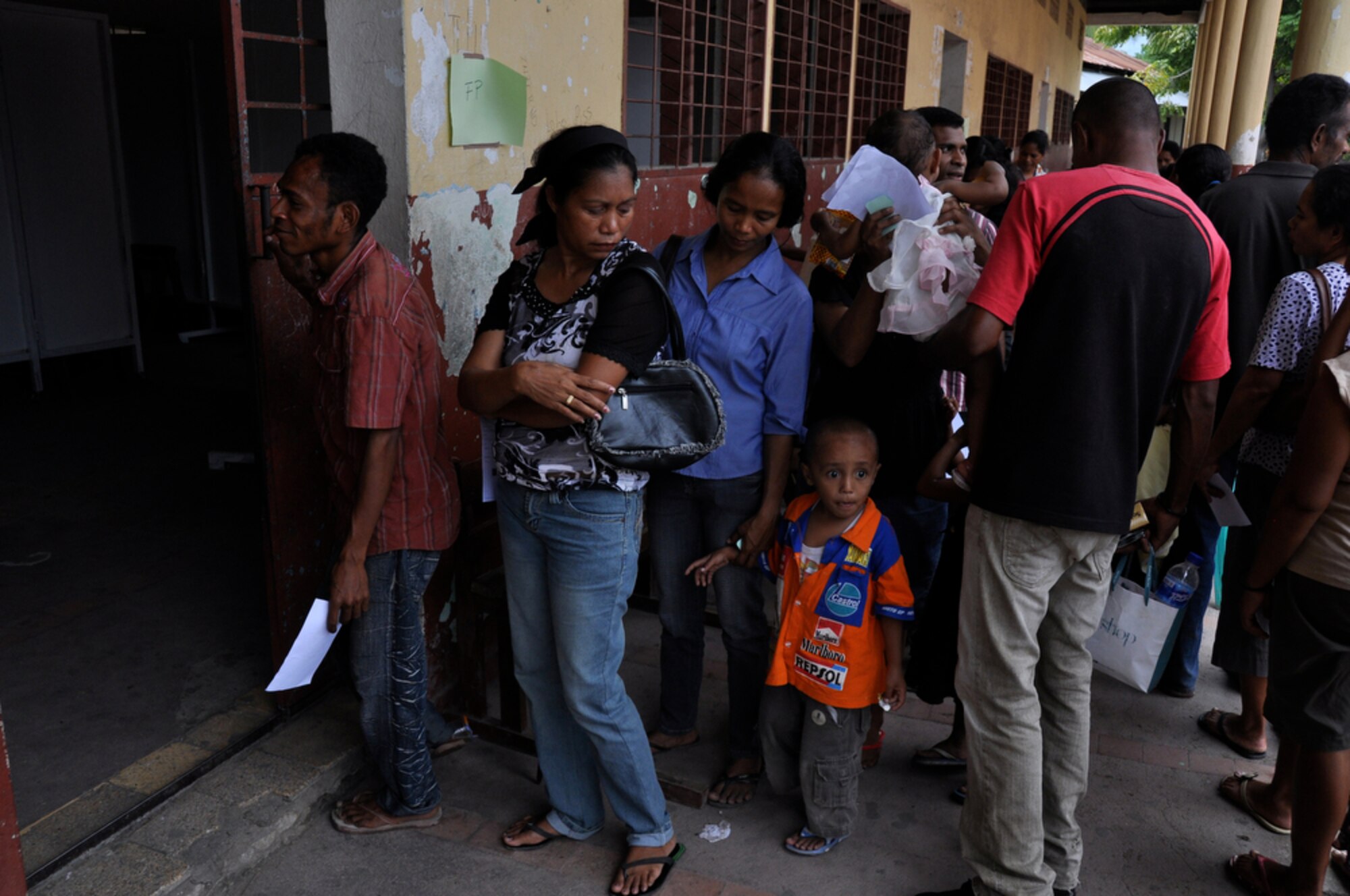 DILI, Timor Leste ? Local East Timorese people line up July 20 outside the family care section of a clinic here, set up as part of Operation Pacific Angel 2009. The family care section has seen more than 1,000 East Timorese patients since opening July 16. Pacific Angel is a Pacific Air Forces humanitarian assistance operation in the Asia-Pacific region led by 13th Air Force at Hickam AFB. (U.S. Air Force photo/Tech. Sgt. Cohen A. Young)