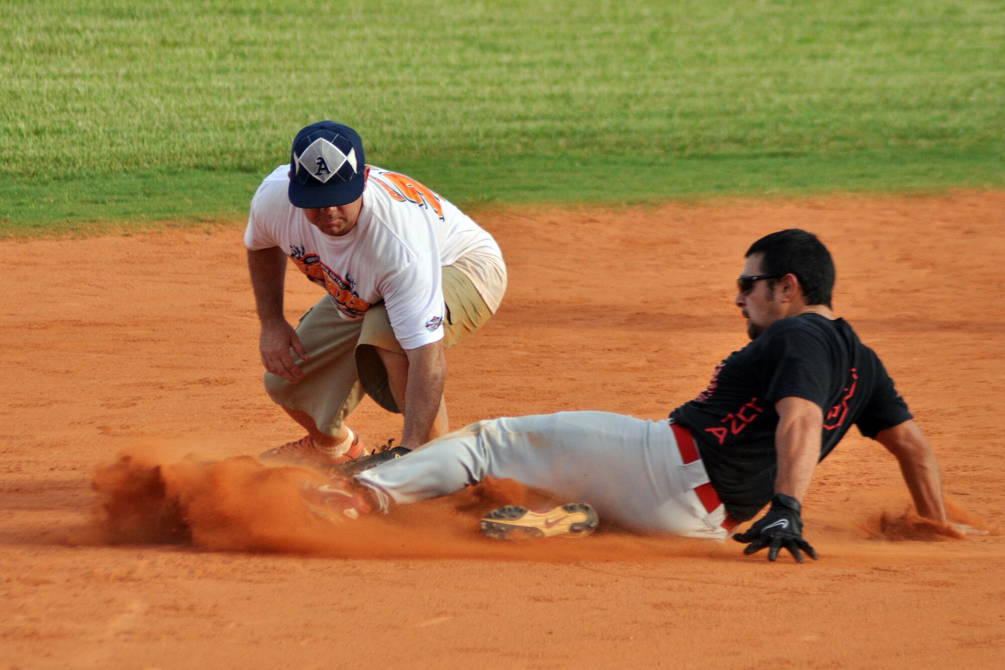 EGLIN AIR FORCE BASE, Fla. --  Fire Department's Louis Luna, slides in safe at second during a matchup against the 1st Special Operations Maintenance Squadron in the 2009 Intramural Softball Championship game, July 16. The Fire Dept. defeated the 1st SOMXS, the defending champs, in a double header. (U.S. Air Force photo/ Airman Anthony Jennings)