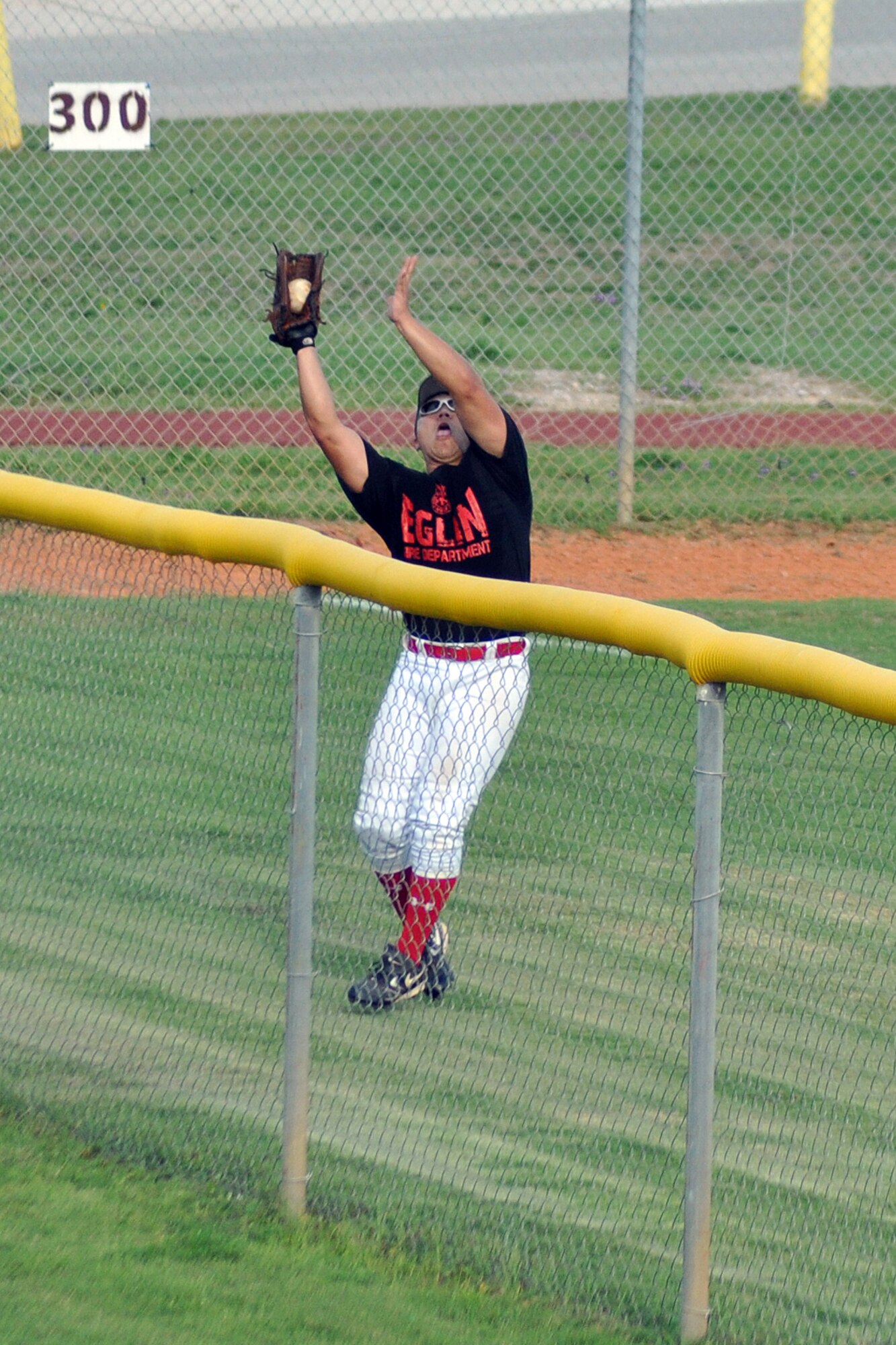 EGLIN AIR FORCE BASE, Fla. --  Fire Department’s left fielder, Jonathon Pfau, catches a fly ball in left field during the 2009 Intramural Softball Championship game against the 1st Special Operations Maintenance Squadron, July 16. The Fire Dept defeated the 1st SOMXS, the defending champs, in a double header. (U.S. Air Force photo/ Airman Anthony Jennings)