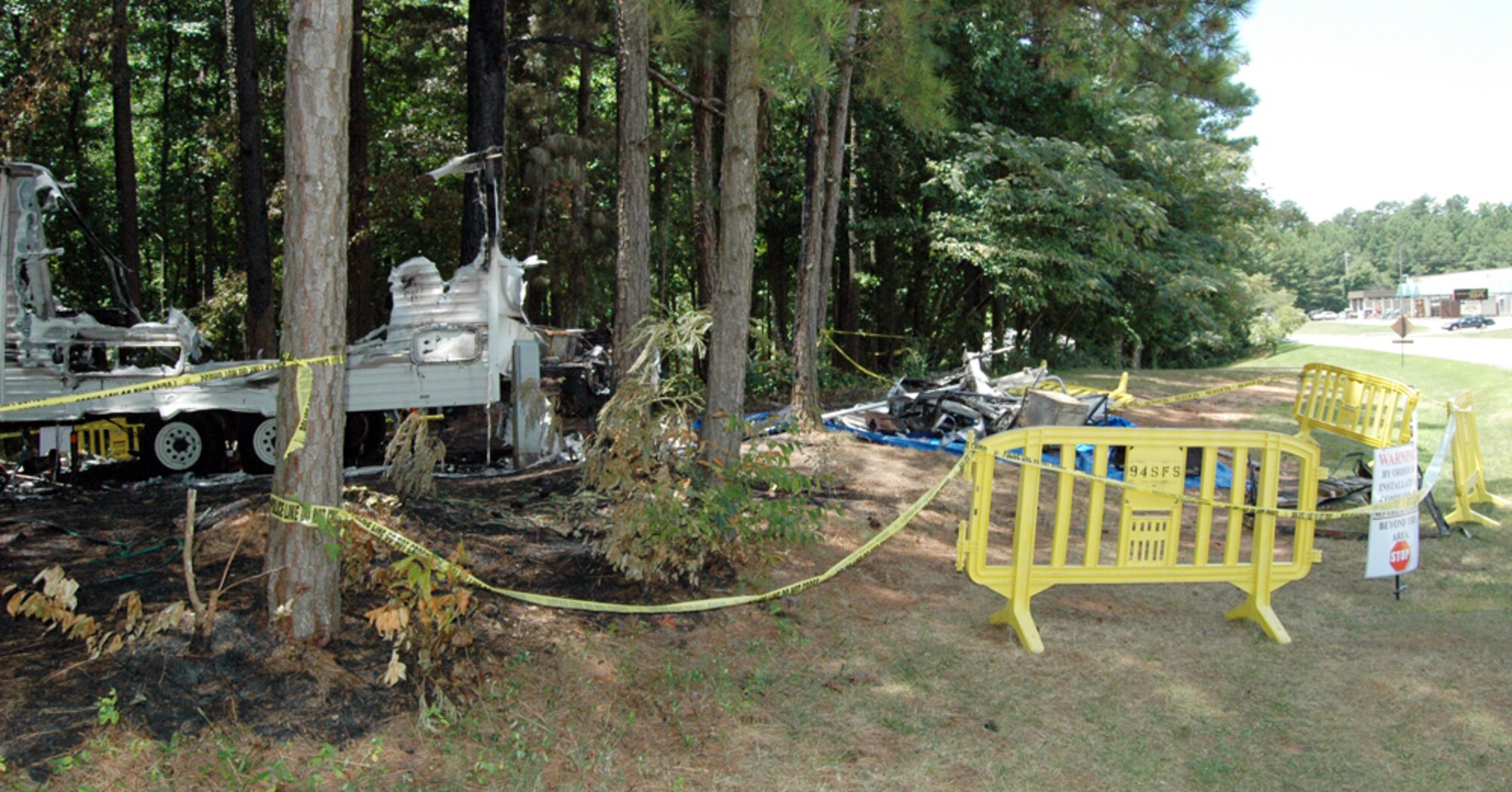 The cordoned area around a recreational trailer that caught on fire around 2:30 a.m. July 17. Nearly a dozen firefighters extinguished the blaze, which caused $30,000 in damages. The cause is currently under investigation. (U.S. Air Force photo/Travon Dennis)