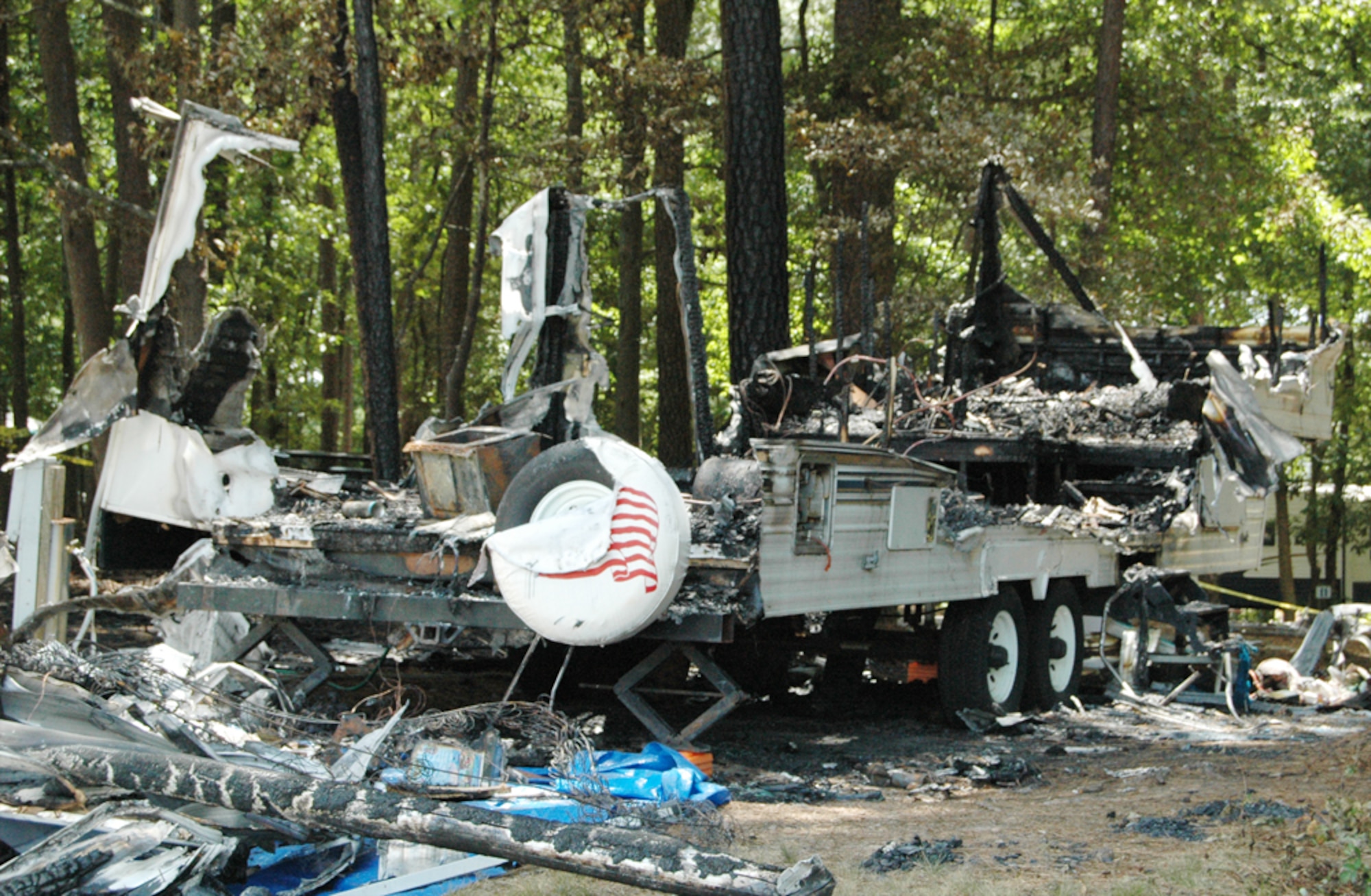 A profile of the recreational trailer that caught on fire around 2:30 a.m. July 17. Nearly a dozen firefighters extinguished the blaze, which caused $30,000 in damages. The cause is currently under investigation. (U.S. Air Force photo/Travon Dennis)
