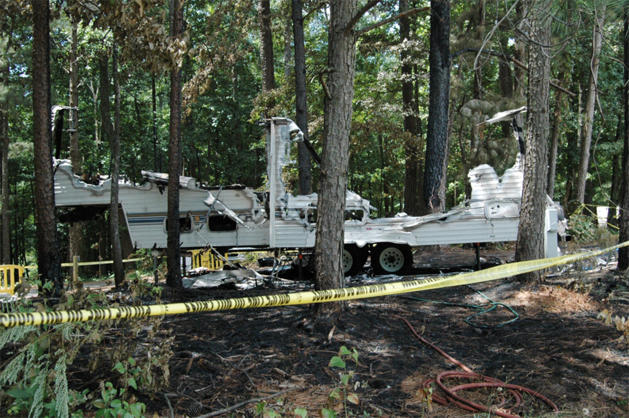 A side profile of the recreational trailer that caught on fire around 2:30 a.m. July 17. Nearly a dozen firefighters extinguished the blaze, which caused $30,000 in damages. The cause is currently under investigation. (U.S. Air Force photo/Travon Dennis)
