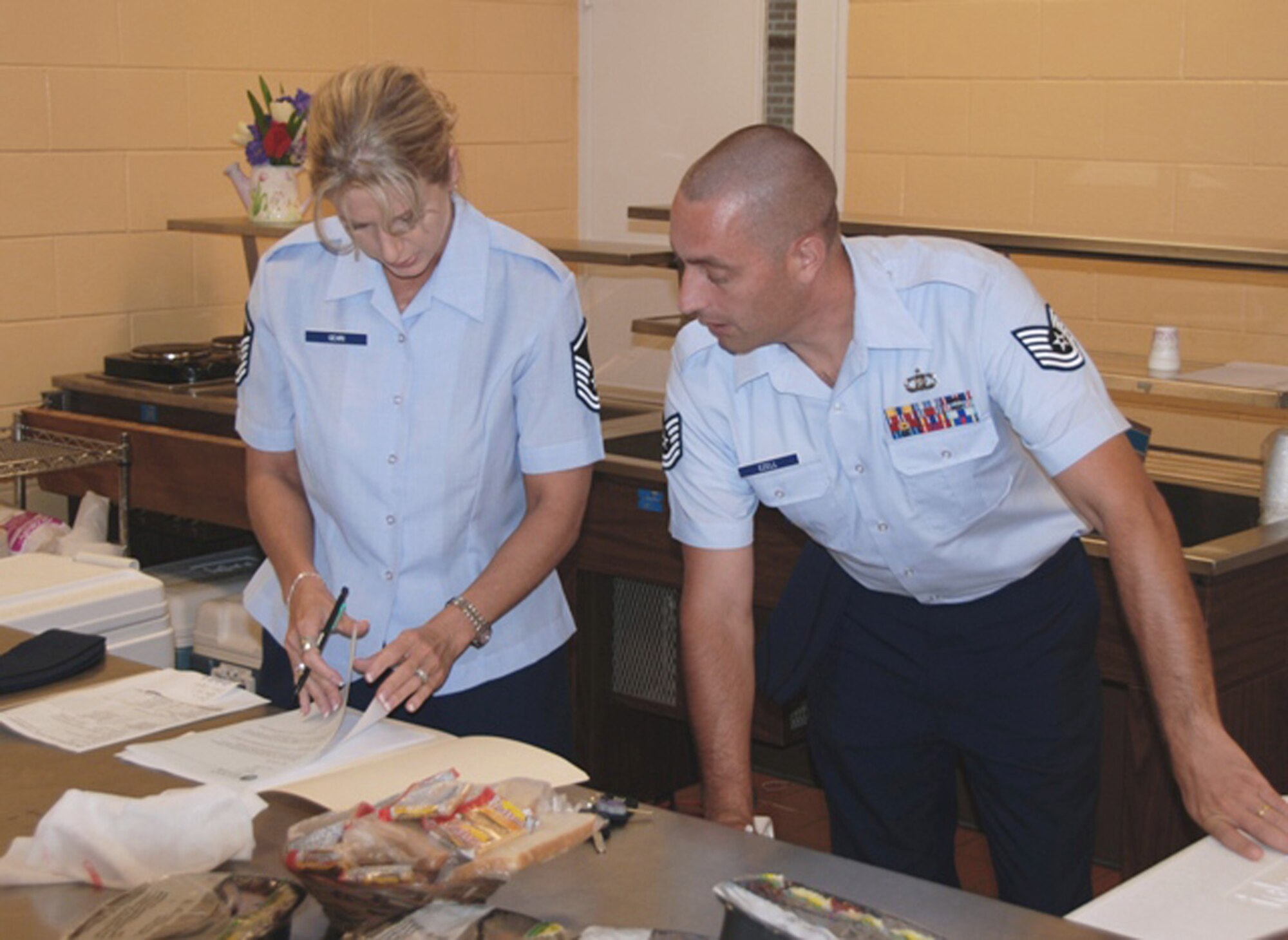 Master Sgt. Wendy Gehri and Tech. Sgt. Joe Ezell, members of the 601st Air and Space Operations Center at Tyndall Air Force Base, Fla., prepare their delivery route while volunteering with the local Bay County Council on Aging Meals on Wheels program.  (U.S. Air Force photo/1st Lt. Jared Scott)