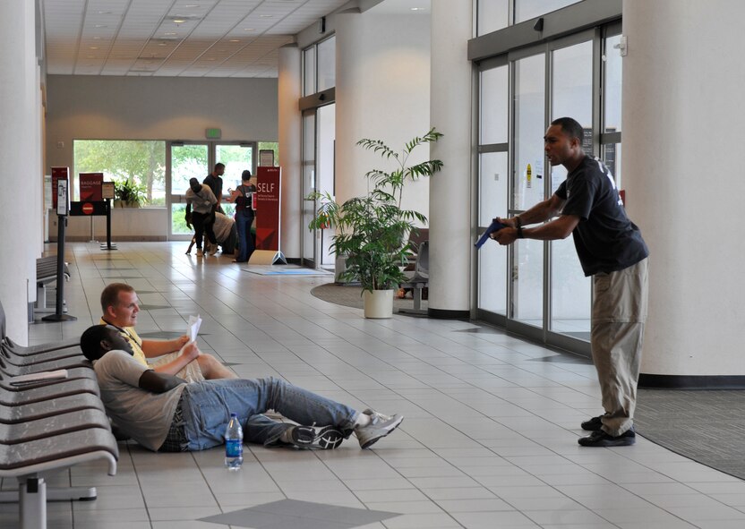 MOODY AIR FORCE BASE, Ga. -- Staff Sgt. Tory Curtis, 23rd Security Forces Squadron military working dog handler, plays the role of an assailant during an emergency response exercise at the Valdosta Regional Airport July 18. This exercise is held annually to help examine Lowndes County's emergengy management's plans, policies and procedures. (U.S. Air Force photo by Senior Airman Schelli Jones)