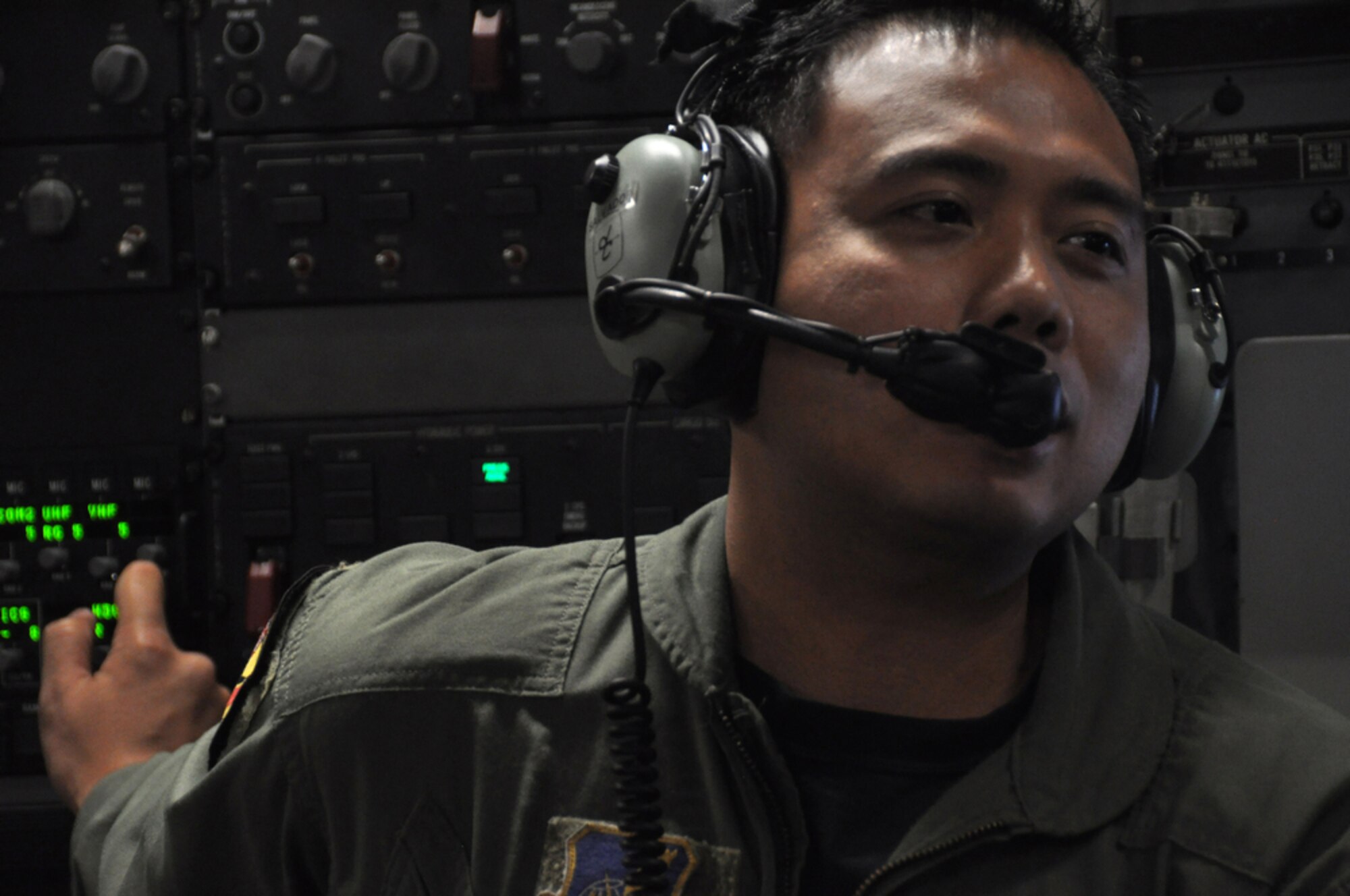 Master Sgt. Joseph Salvador makes an announcement to passengers while en route to Kupang, Indonesia, July 15 to support of Operation Pacific Angel 2009. Sergeant Salvador is a loadmaster with the Hawaii Air National Guard?s 204th Airlift Squadron at Hickam Air Force Base, Hawaii. Pacific Angel is a Pacific Air Forces humanitarian assistance operation in the Asia-Pacific region led by 13th Air Force at Hickam AFB. (U.S. Air Force photo/Tech. Sgt. Cohen A. Young)