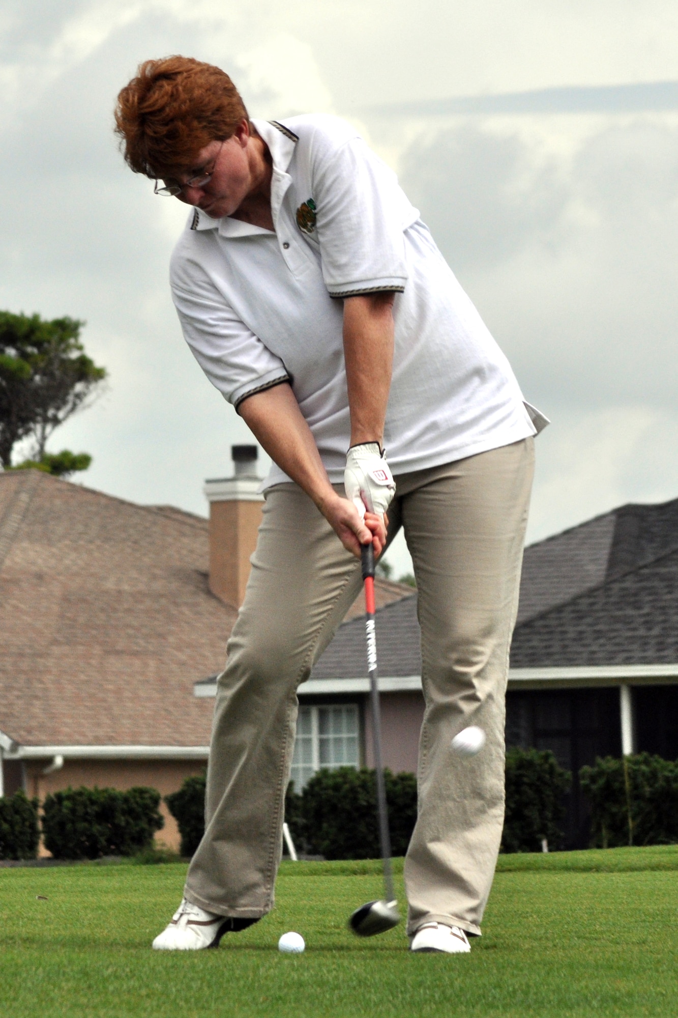 Capt. Maggie Morrison, 86th Fighter Weapons Squadron, swings away at Shalimar Pointe Golf Course during the 53d Wing's Sword Top 4 Golf Tournament, July 17. The tournament raised $ 9,250 for the Air Force Enlisted Village. (U.S. Air Force photo/ Airman Anthony Jennings.)
