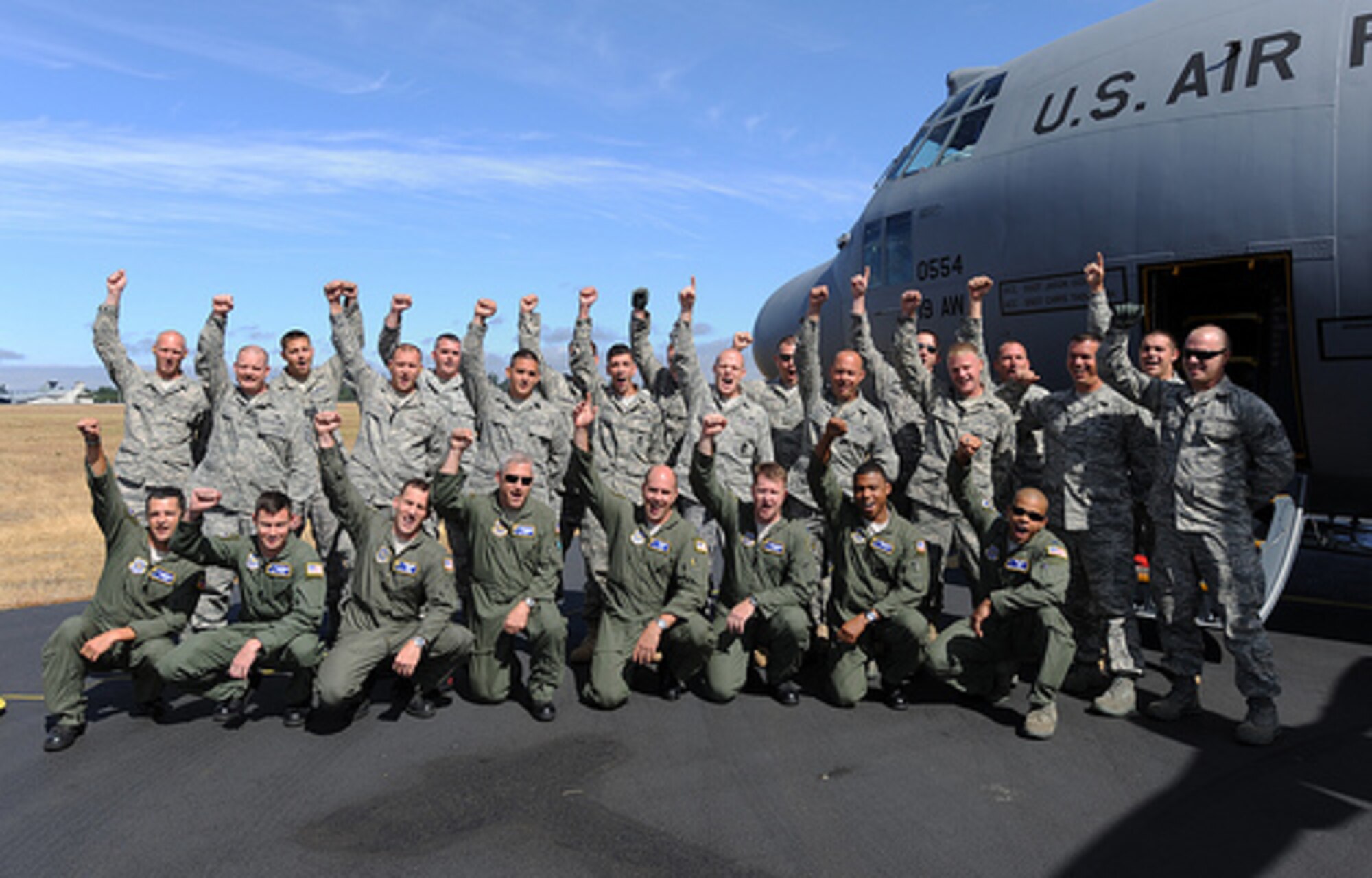 Members of the 19th Airlift Wing, Little Rock Air Force Base, Ark., gather
for group photo after arriving at McChord Air Force Base, Wash., for Air
Mobility RODEO 2009, July 18. RODEO is an international combat skills and
flying operations competition designed to develop and improve techniques and
procedures with our international partners to enhance mobility operations.
(U.S. Air Force photo by Staff Sgt. Christine Jones)