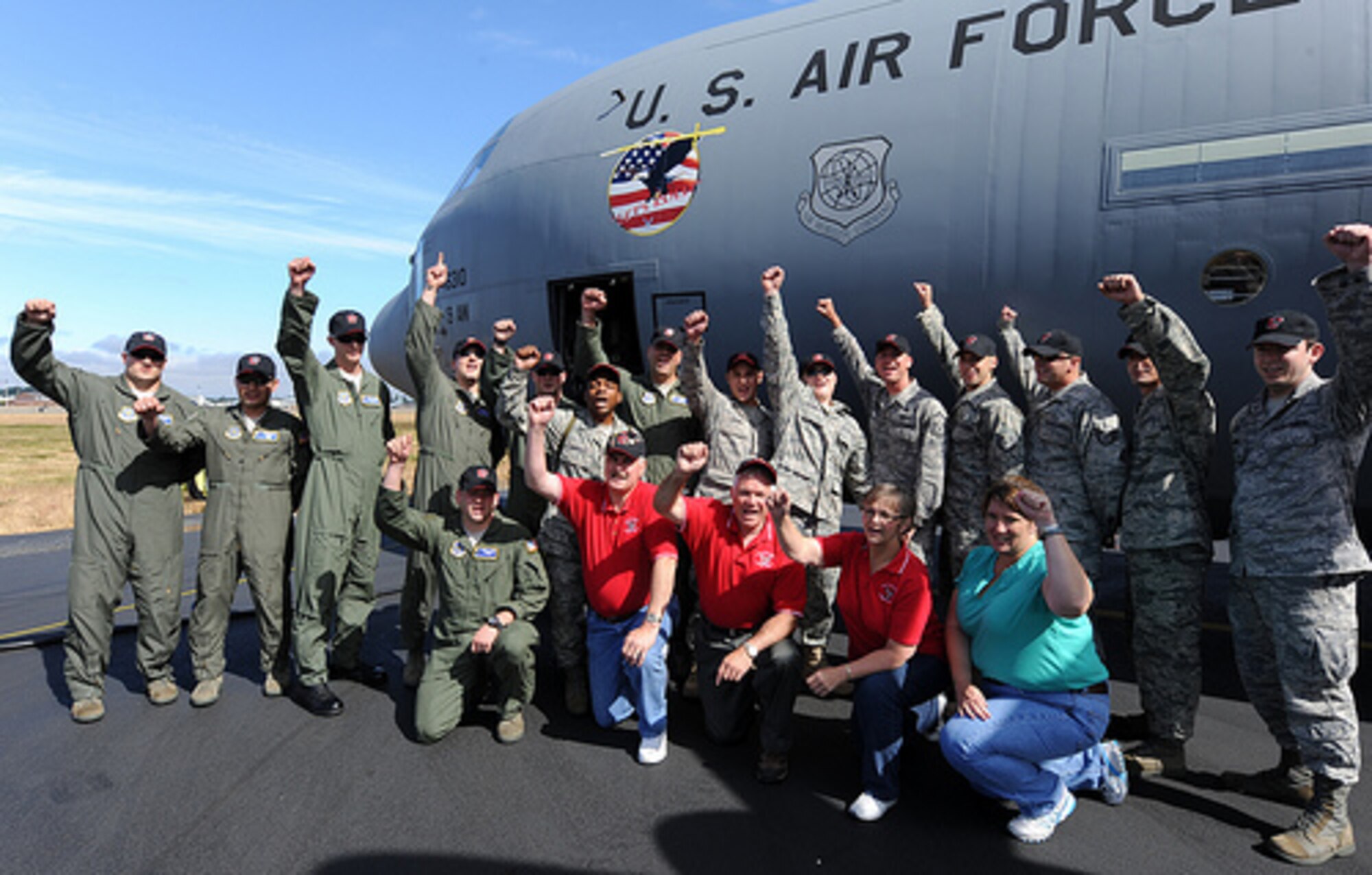 Members of the 19th Airlift Wing, Little Rock Air Force Base, Ark., gather
for group photo after arriving at McChord Air Force Base, Wash., for Air
Mobility RODEO 2009, July 18. RODEO is an international combat skills and
flying operations competition designed to develop and improve techniques and
procedures with our international partners to enhance mobility operations.
(U.S. Air Force photo by Staff Sgt. Christine Jones)