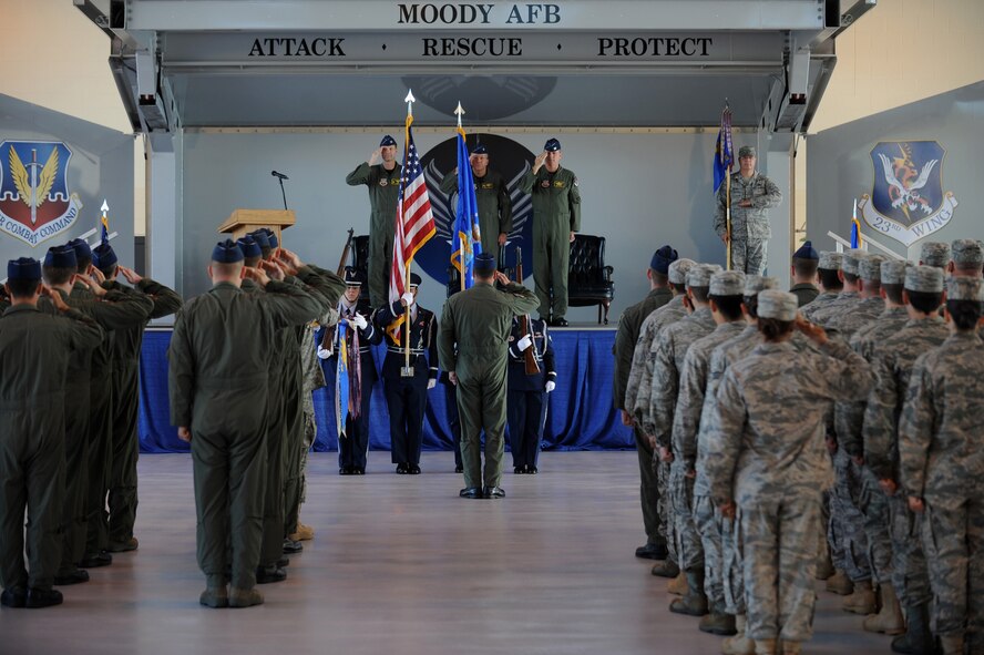 MOODY AIR FORCE BASE, Ga. -- Airmen salute as the Moody Air Force Honor Guard presents the colors during a change of command ceremony here July 20. Col. Michael O'Dowd relinquished command of the 23rd Fighter Group to Col. Ellwood Hinman IV. (U.S. Air Force photo by Tech. Sgt. Jeffrey Allen)